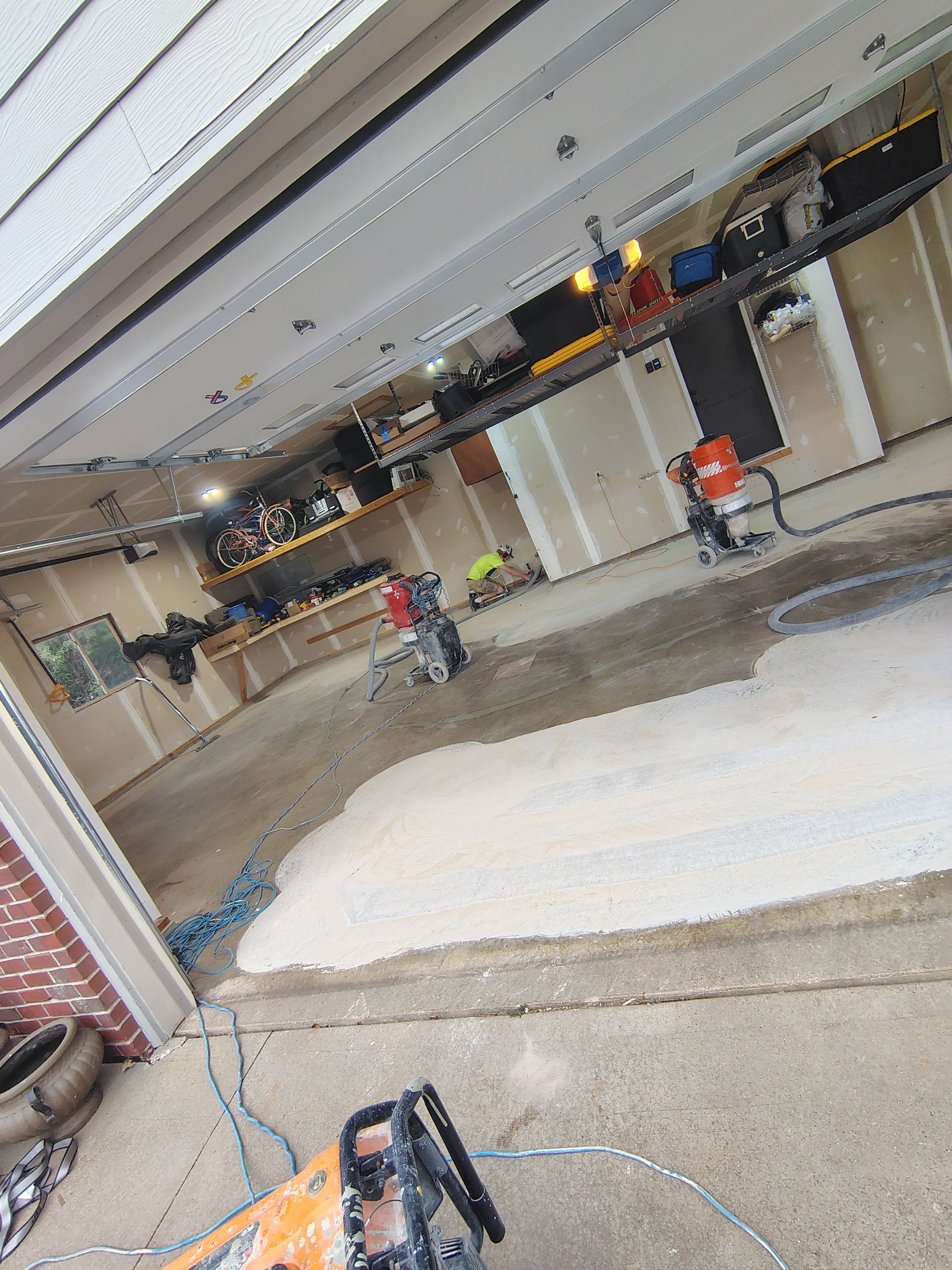 Sioux Falls Garage Concrete Grinding and Nightfall Decorative Chip Coating by Select Painting, Coatings & Garage Cabinets