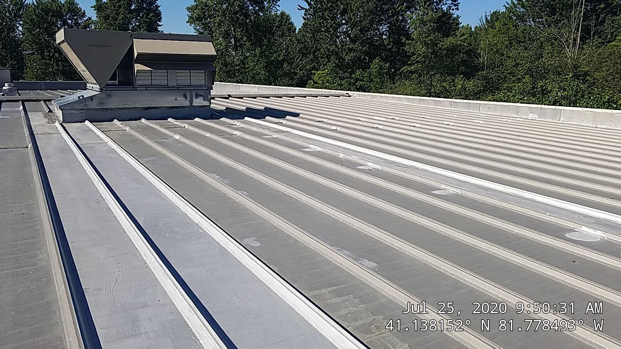 Commercial Metal Roof Coating by Gold Star Roofing LLC