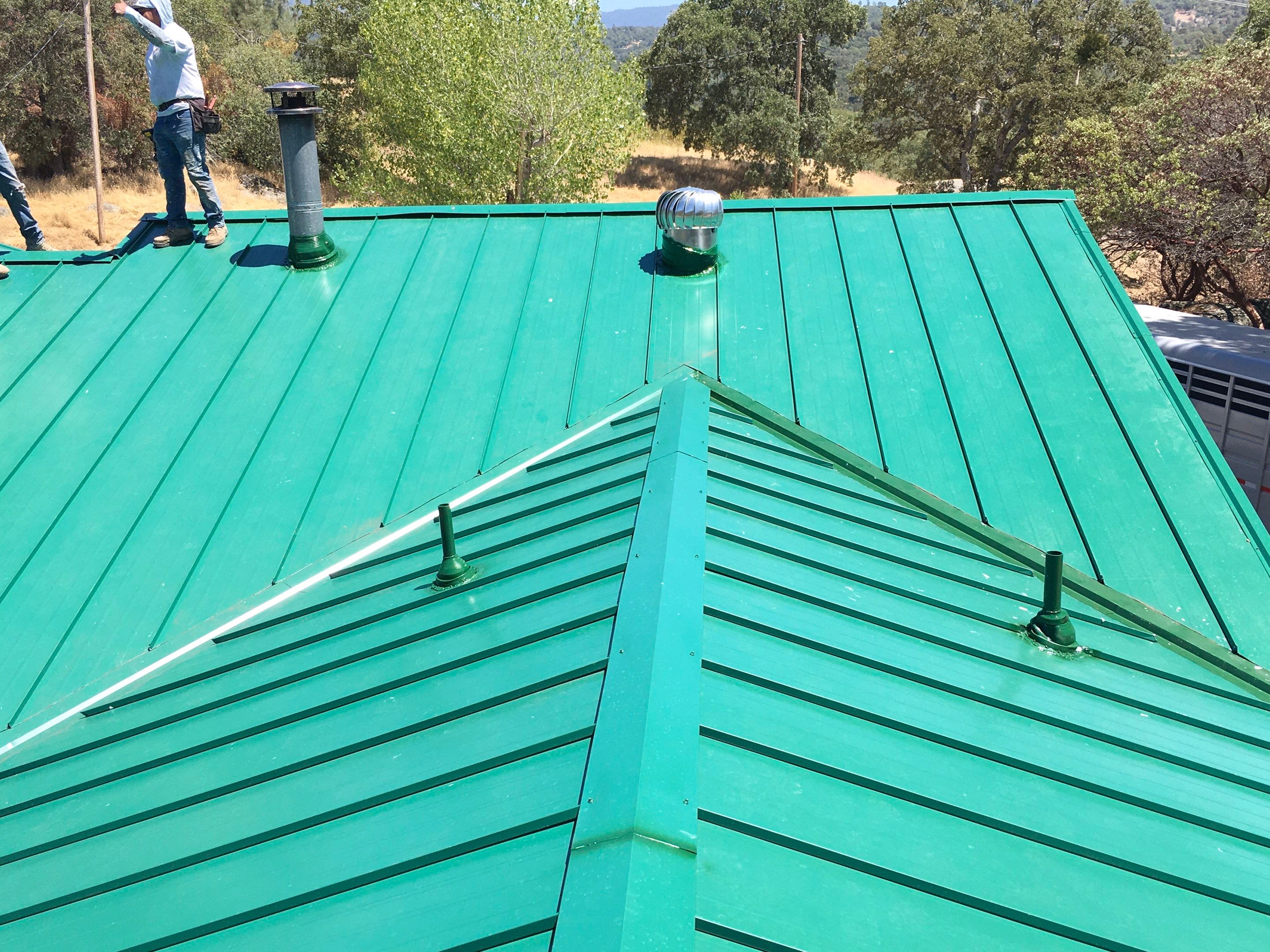Metal roofing installation using Standing seam metal roofing system by Straight Edge Roofing Inc