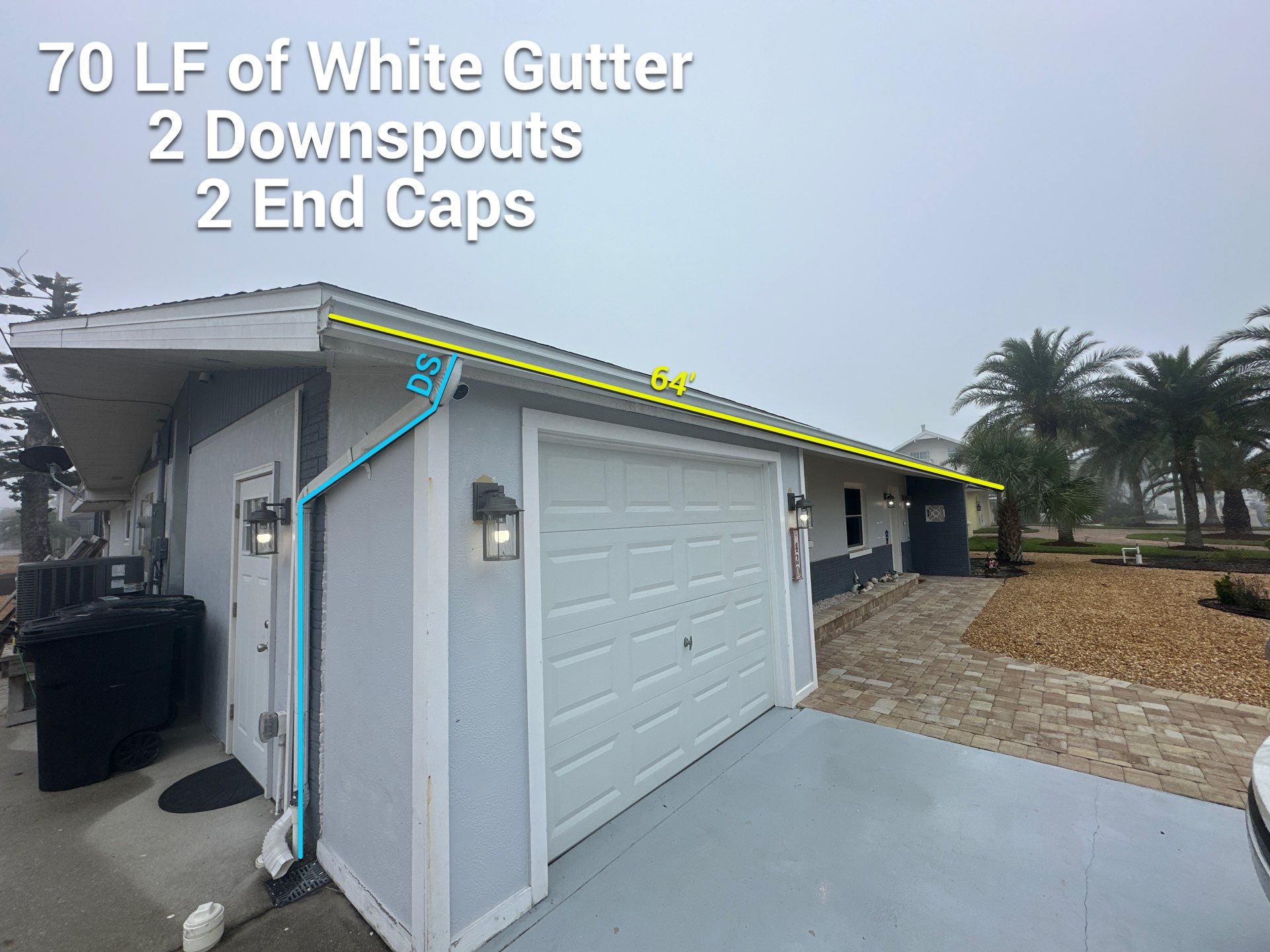 White Seamless Gutters with Matching Downspouts in Fort Myers Beach FL by Gutter Professors