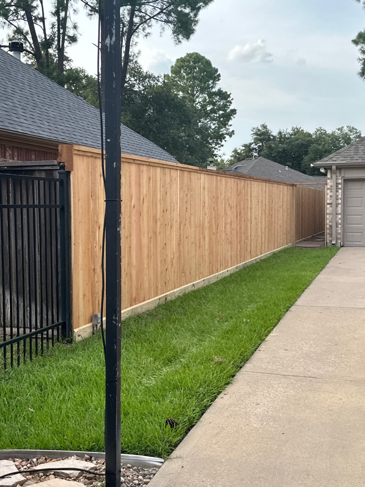 Wood fence project in Cypress by Tim's Fences