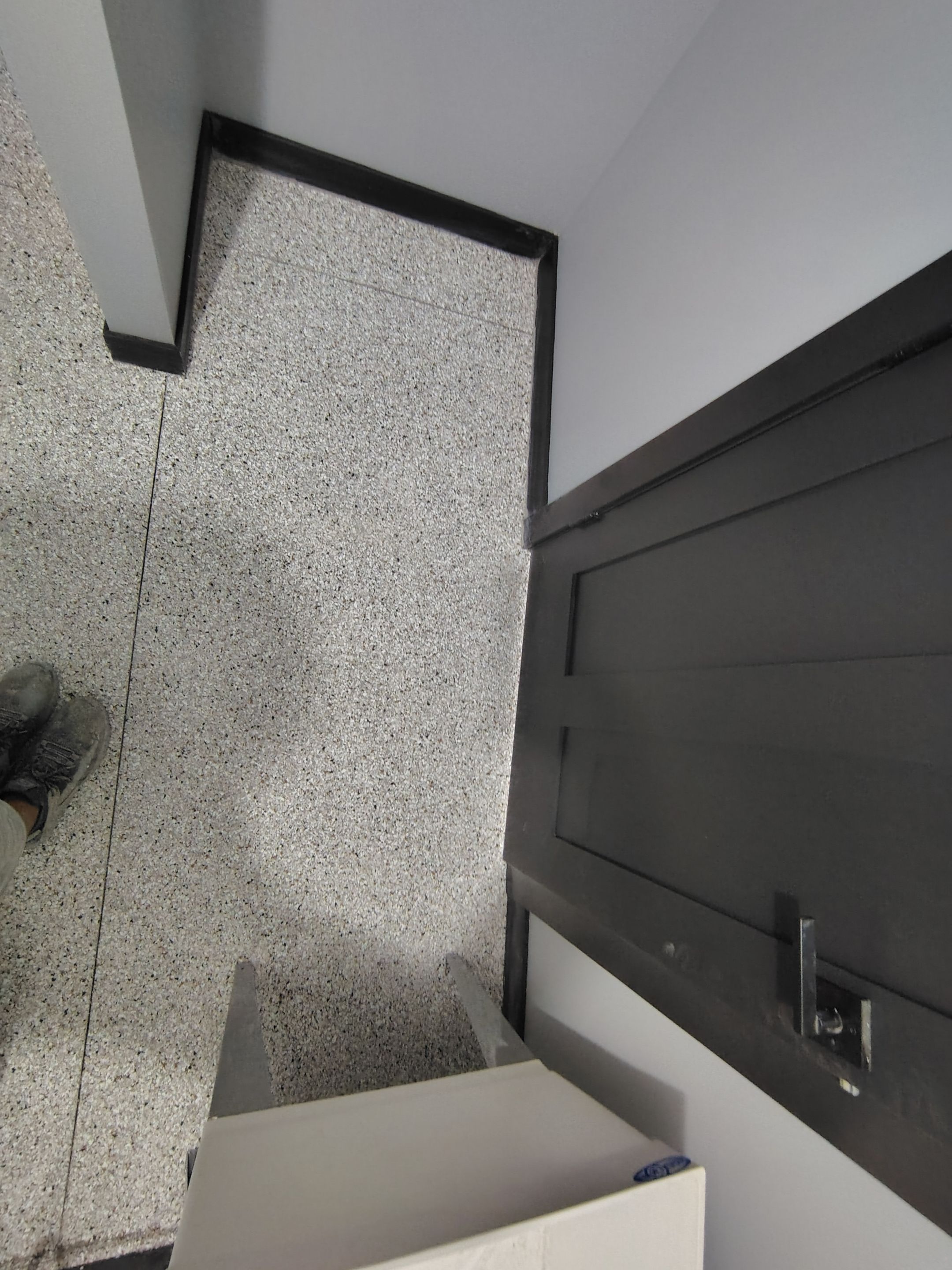 Polyaspartic Garage Floor Coating with Decorative Flake in Wentworth by Select Painting, Coatings & Garage Cabinets
