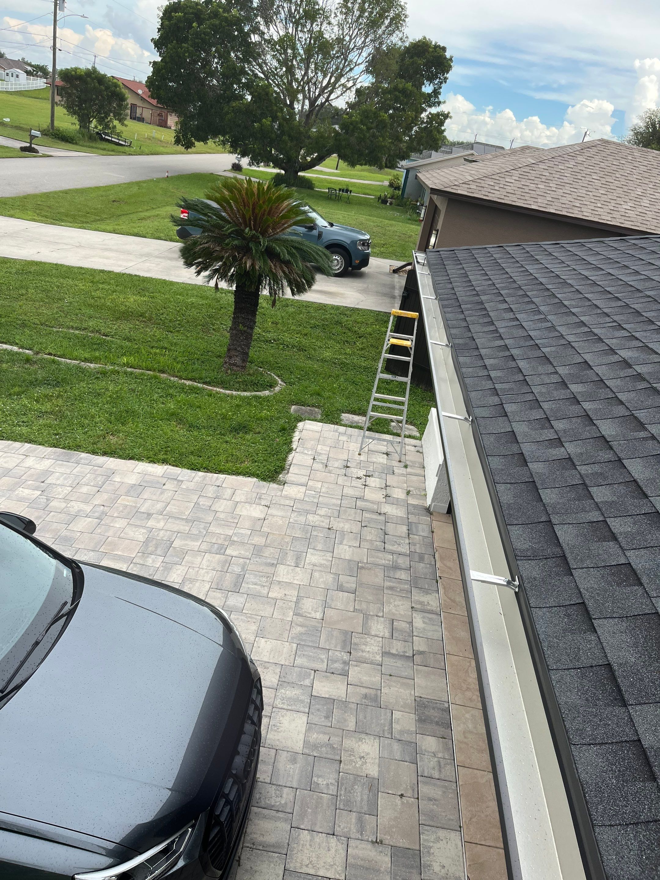 Black Seamless Gutters for a Modern Look in Cape Coral FL by Gutter Professors