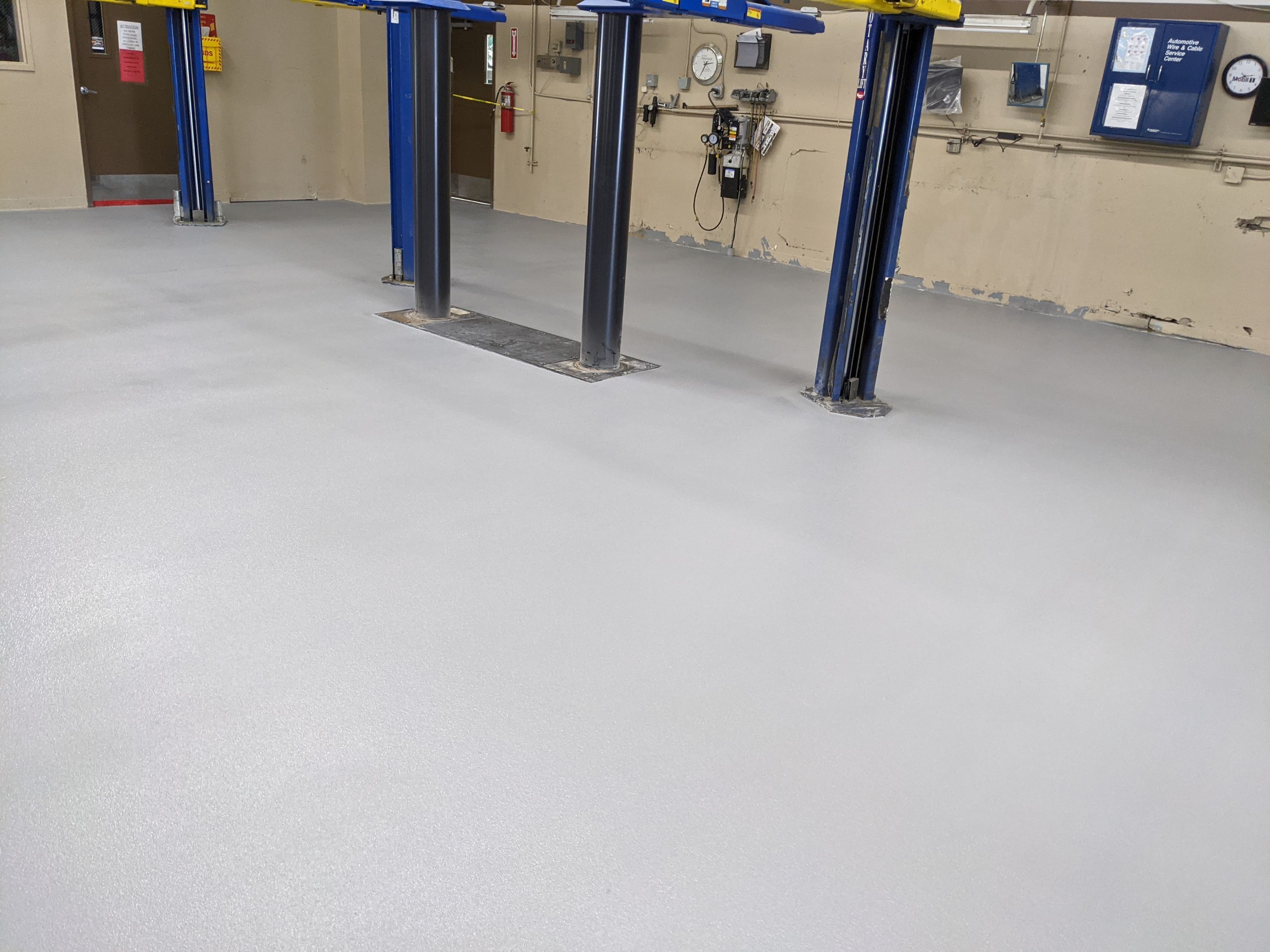 Commercial Floor Transformation using Penntek Shop Floor System by Croc Coatings, LLC