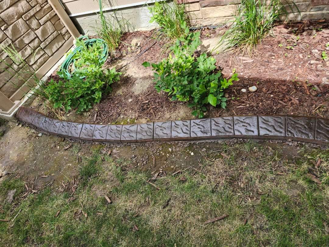 Decorative Stamped Concrete Landscape Edging Installation in Medicine Hat by Pump it Up Concrete Jacking
