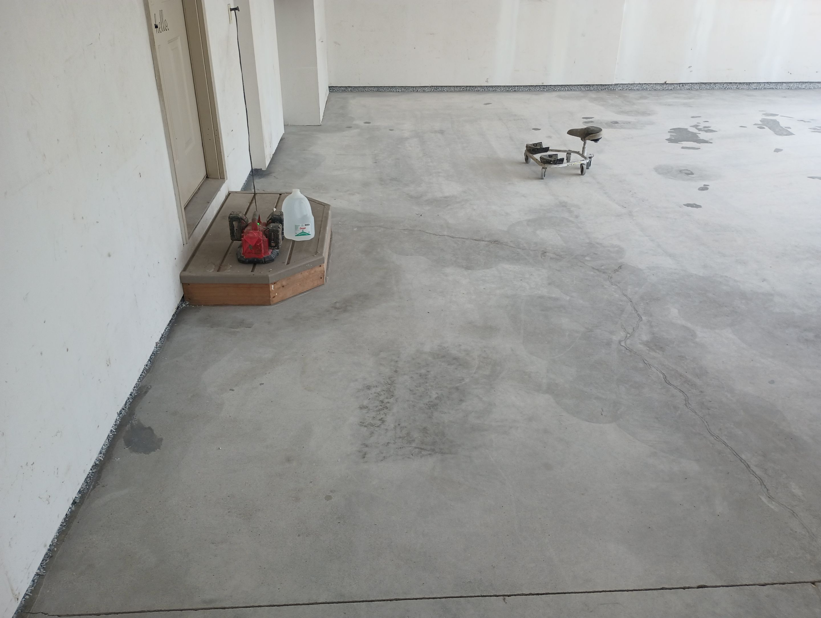 Garage Concrete Coating Installation in Sioux Falls Using Tidal Wave Finish by Select Painting, Coatings & Garage Cabinets