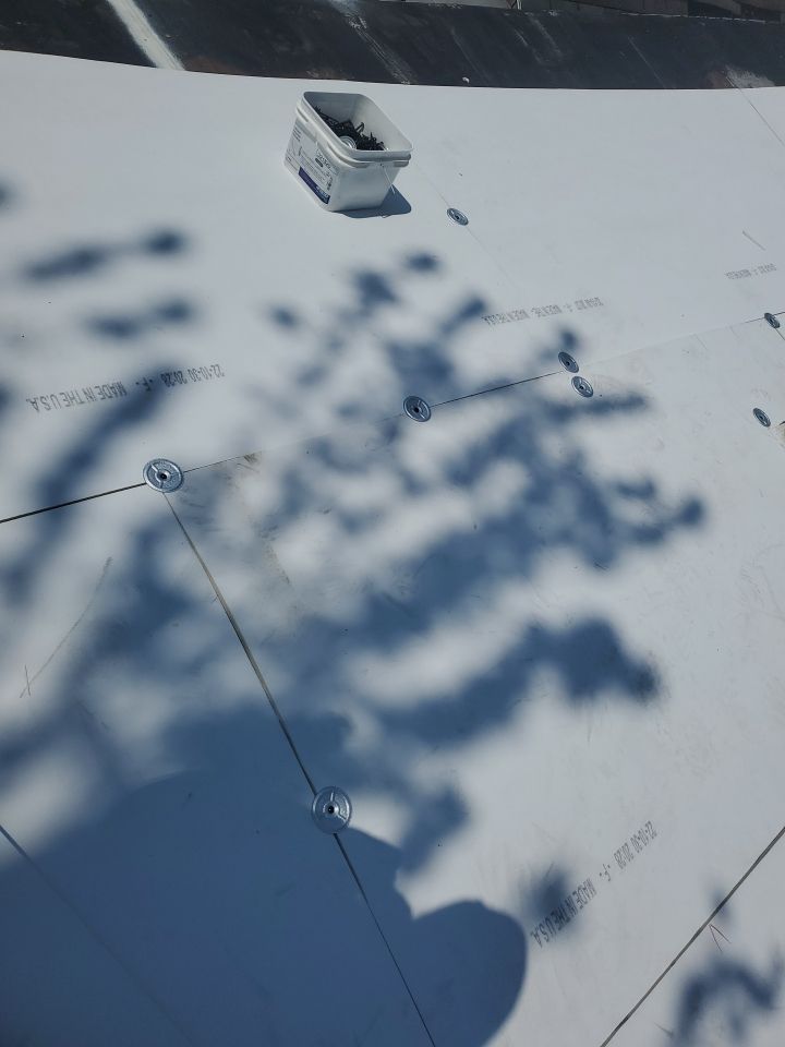 Residential Roofing Installation using 60 mil rubber roof  by Nitro Roofing and Construction