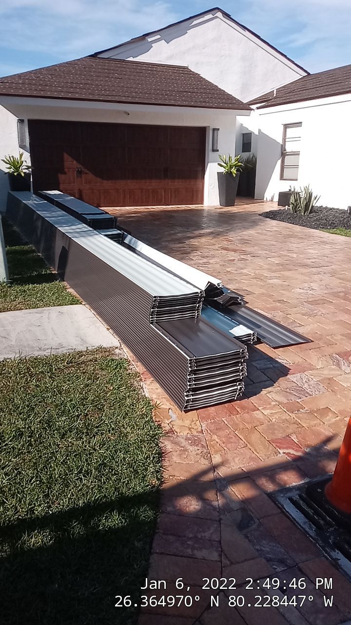 Residential Roofing Installation using 1" Nail strip metal roof by BLUES BROTHERS CONSTRUCTION CORP