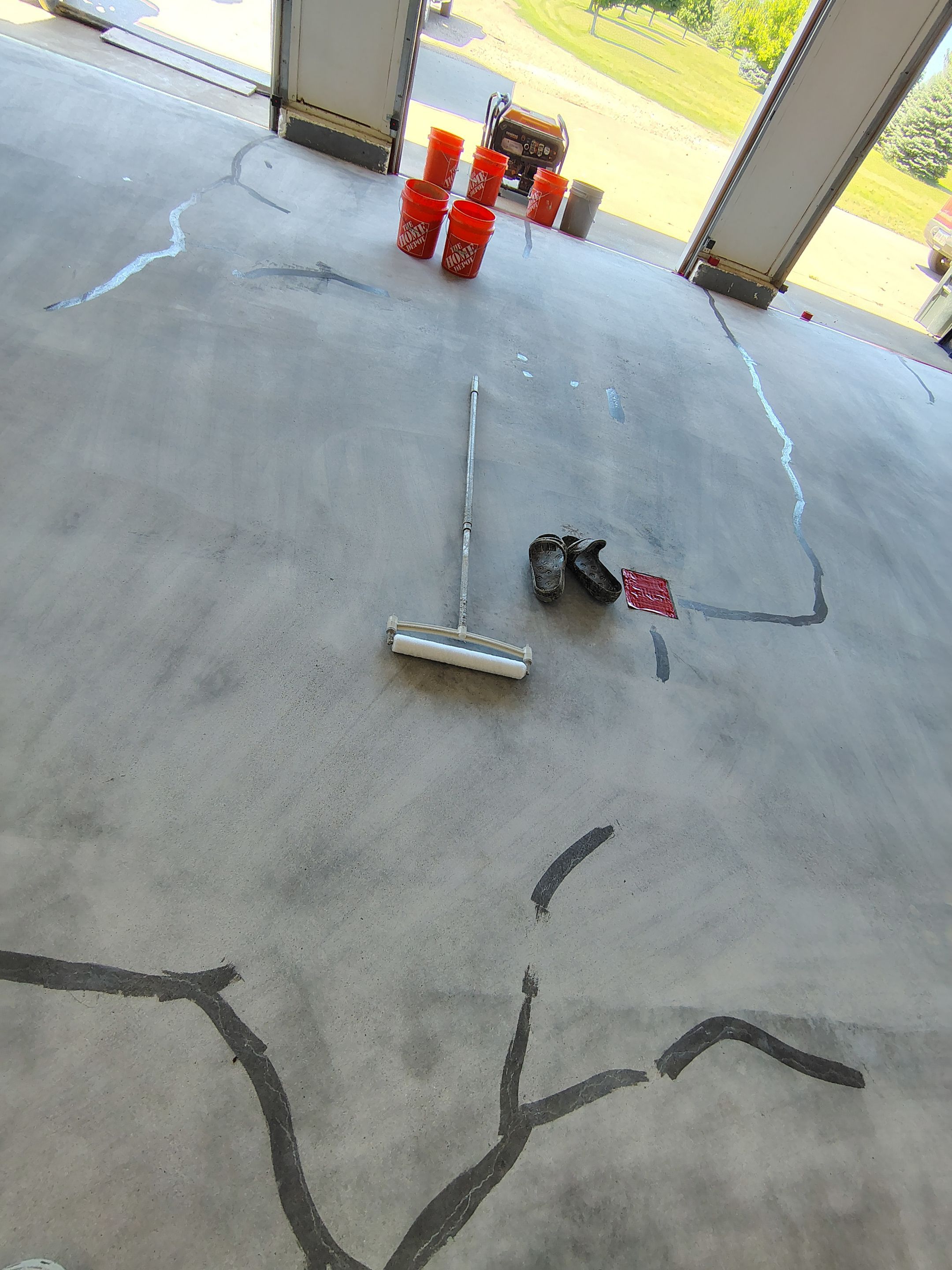 Feather Grey Garage Floor Coating Installation in Valley Springs by Select Painting, Coatings & Garage Cabinets