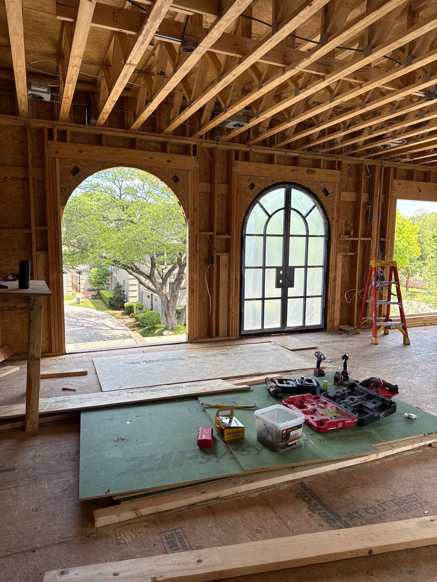 Arched Black Metal French Door Installation and Finishing in Fort Worth by Solara Custom Living