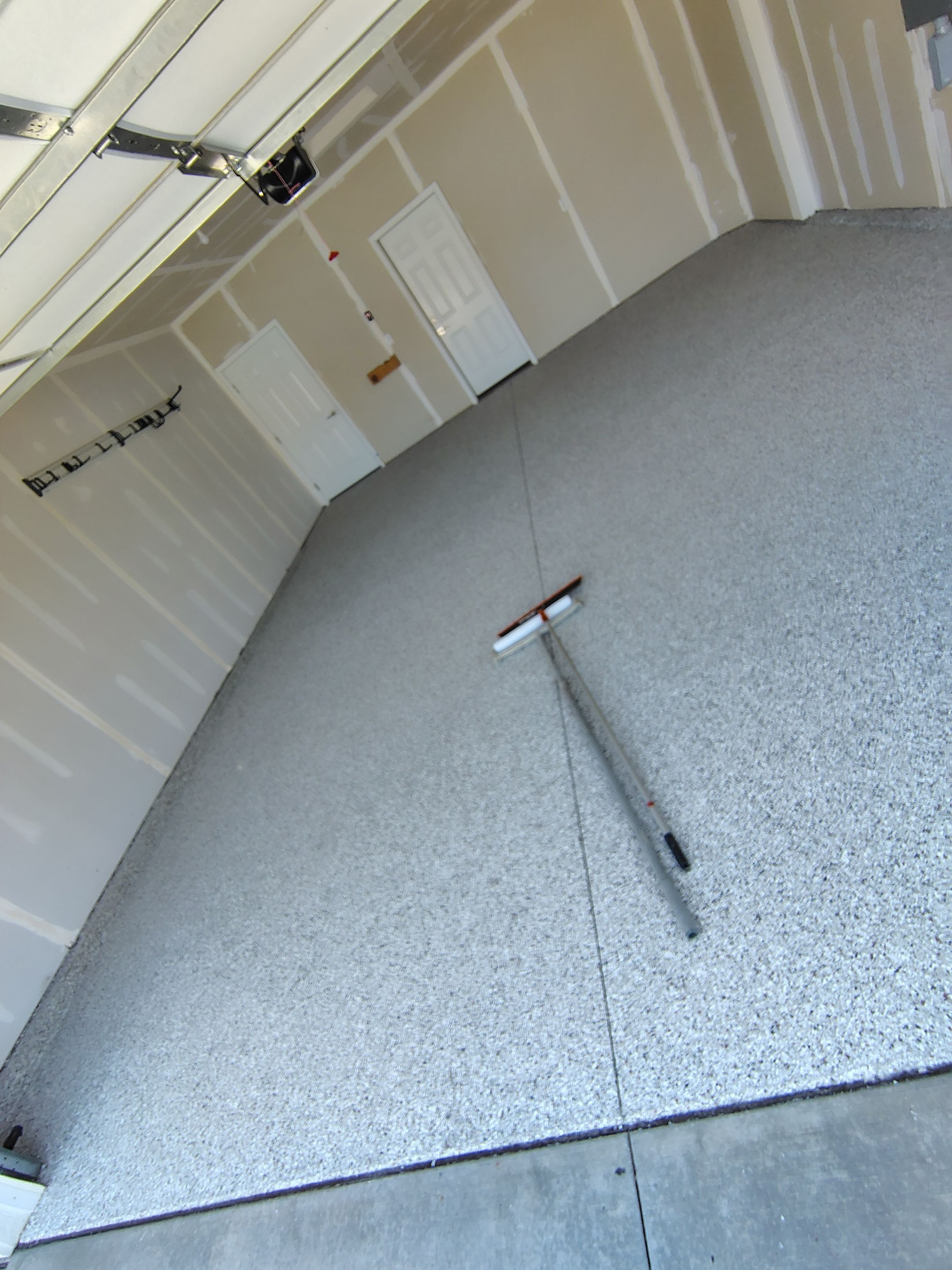 Custom Epoxy Garage Floor and Patio Coating in Sioux Falls by Select Painting, Coatings & Garage Cabinets