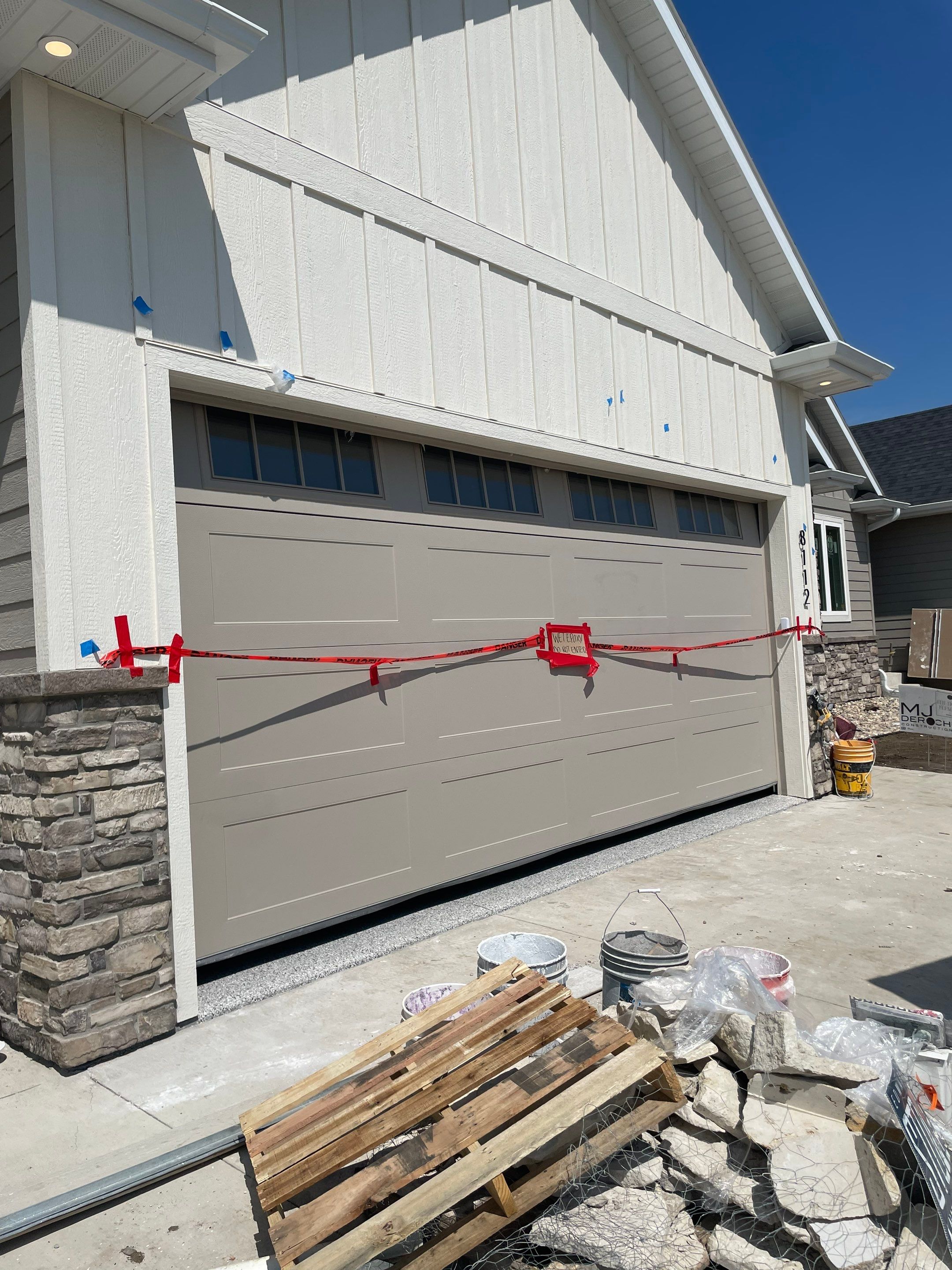 Grey Speckled Garage Floor Coating in Sioux Falls by Select Painting, Coatings & Garage Cabinets