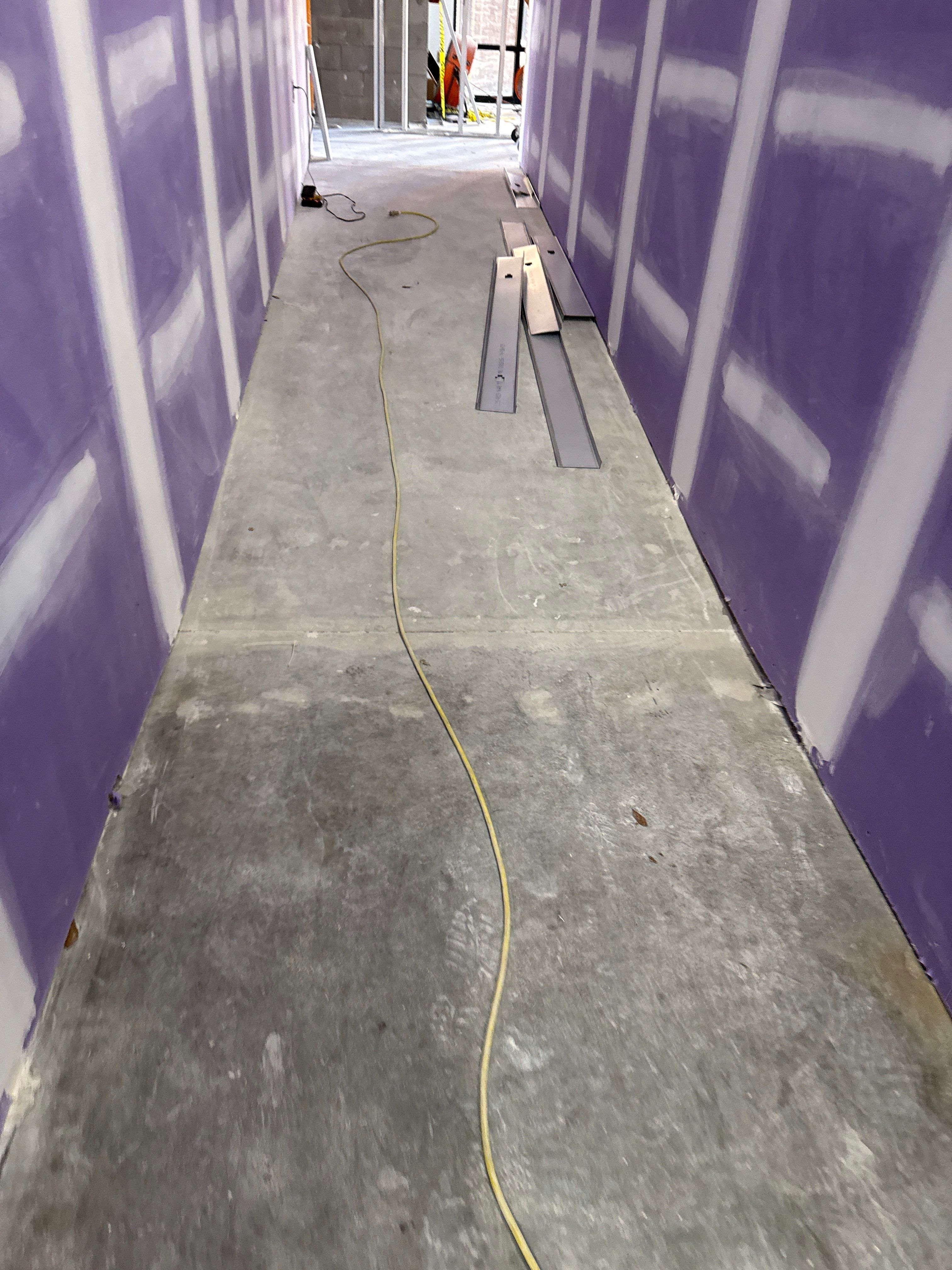 Industrial Epoxy Flake and Concrete Overlay Floor Installation in Pensacola by Cornerstone Hard Surface Restoration