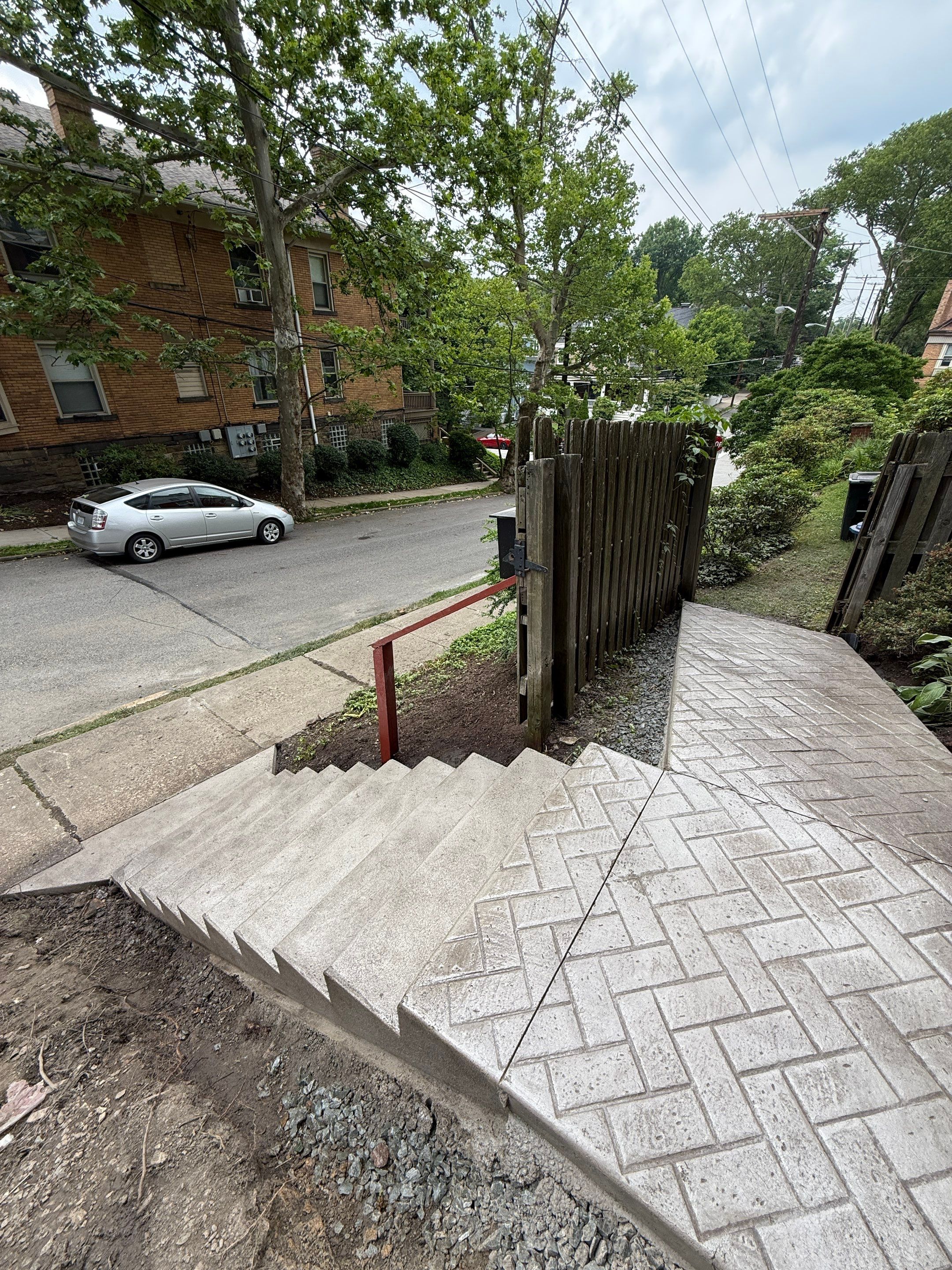 Stamped Concrete and Retaining Wall by Cousins Roofing Siding & Decks