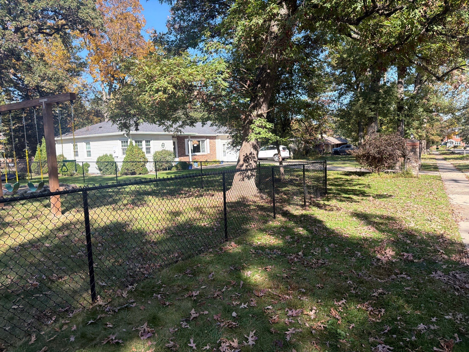 Residential Black Chain Link Fencing in Cedar Falls by Perfect Picket Fence and Stain