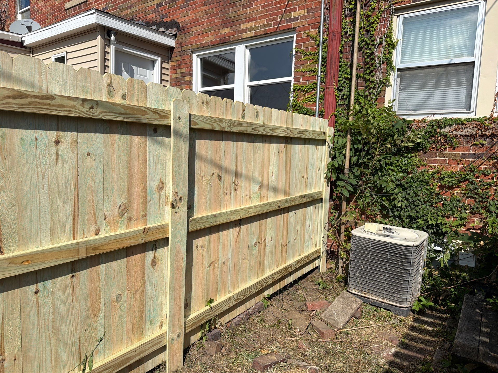New Treated Wood Privacy Fence and Metal-Framed Gates by Perfect Picket Fence and Stain