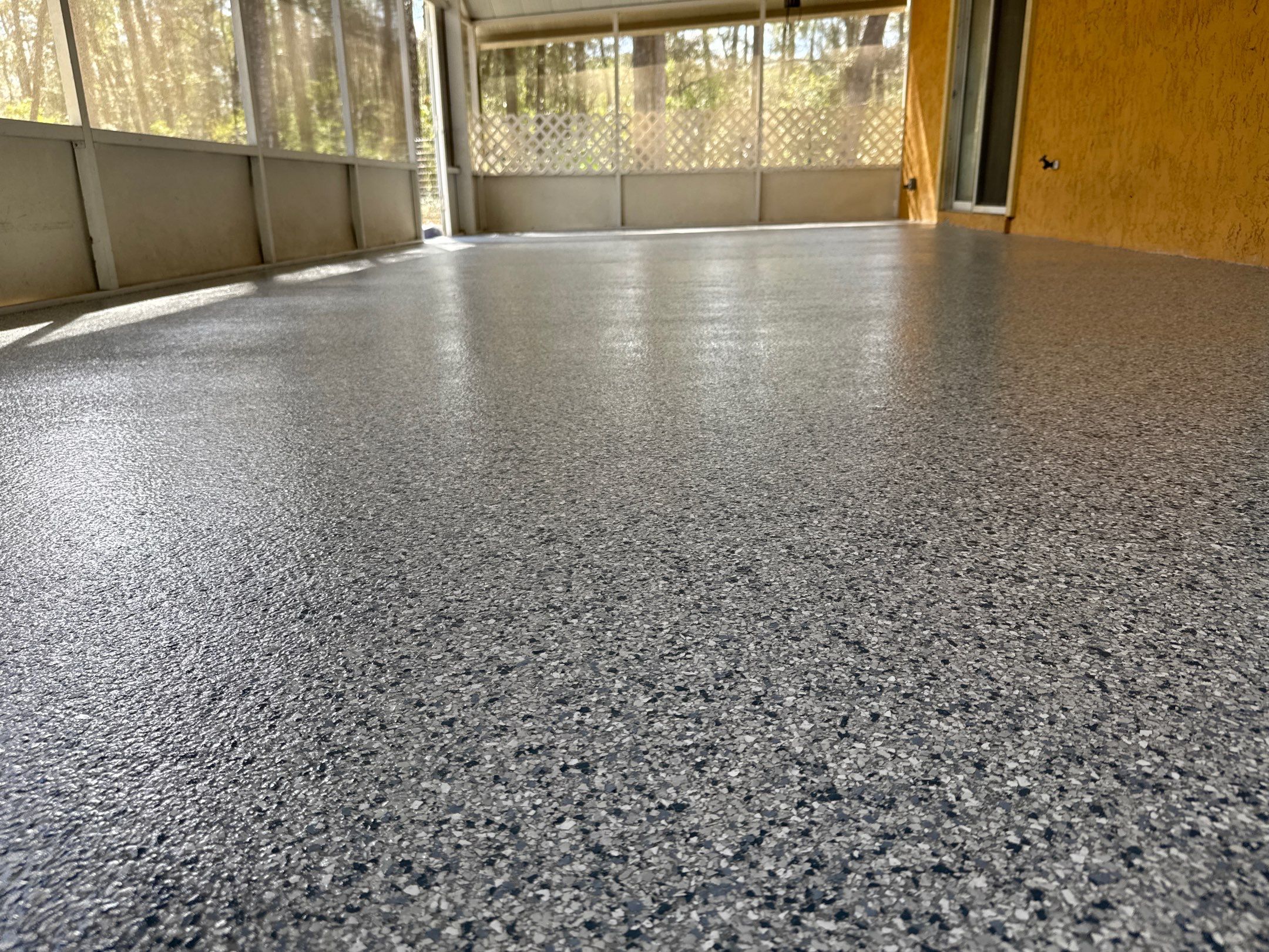 Patio in Tidal Wave by Cross Creek Concrete Coatings