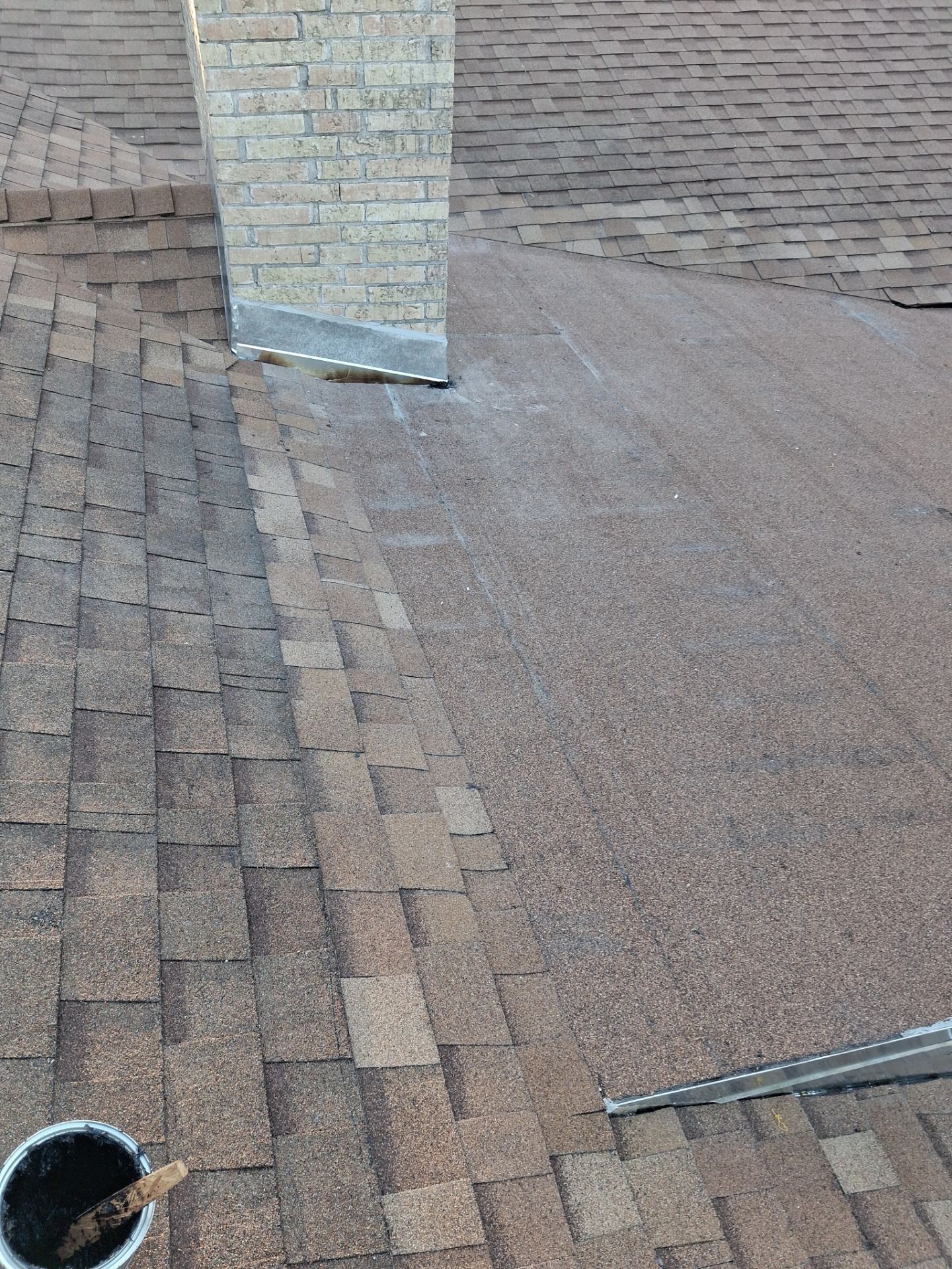 Chimneys need a Cricket.  by Bayfront Roofing and Construction