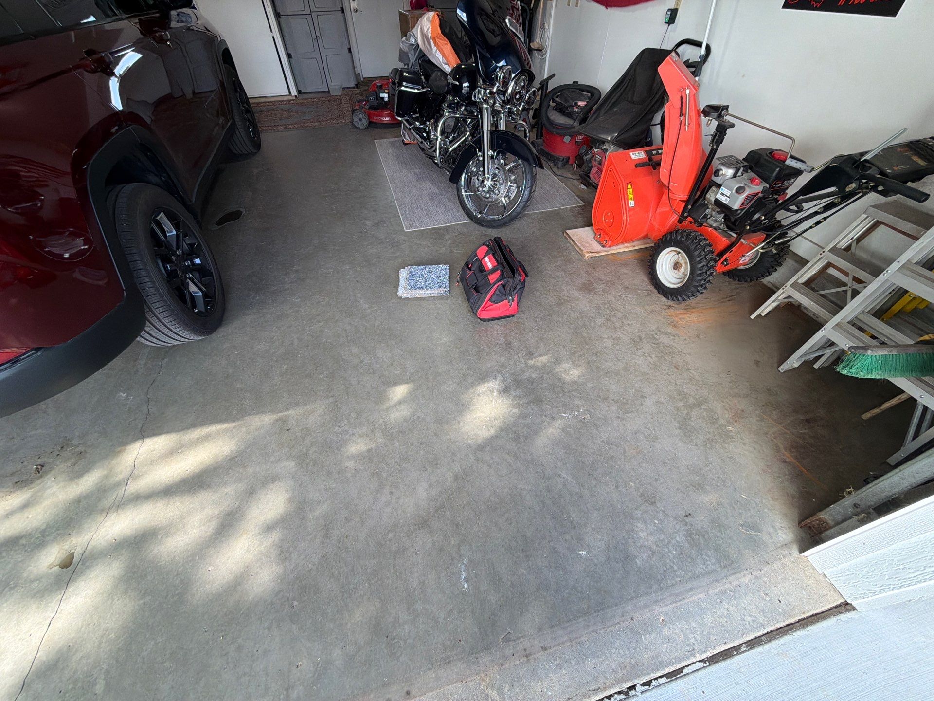 Residential Garage Floor Coating with Feather Grey Finish in Sioux Falls by Select Painting, Coatings & Garage Cabinets