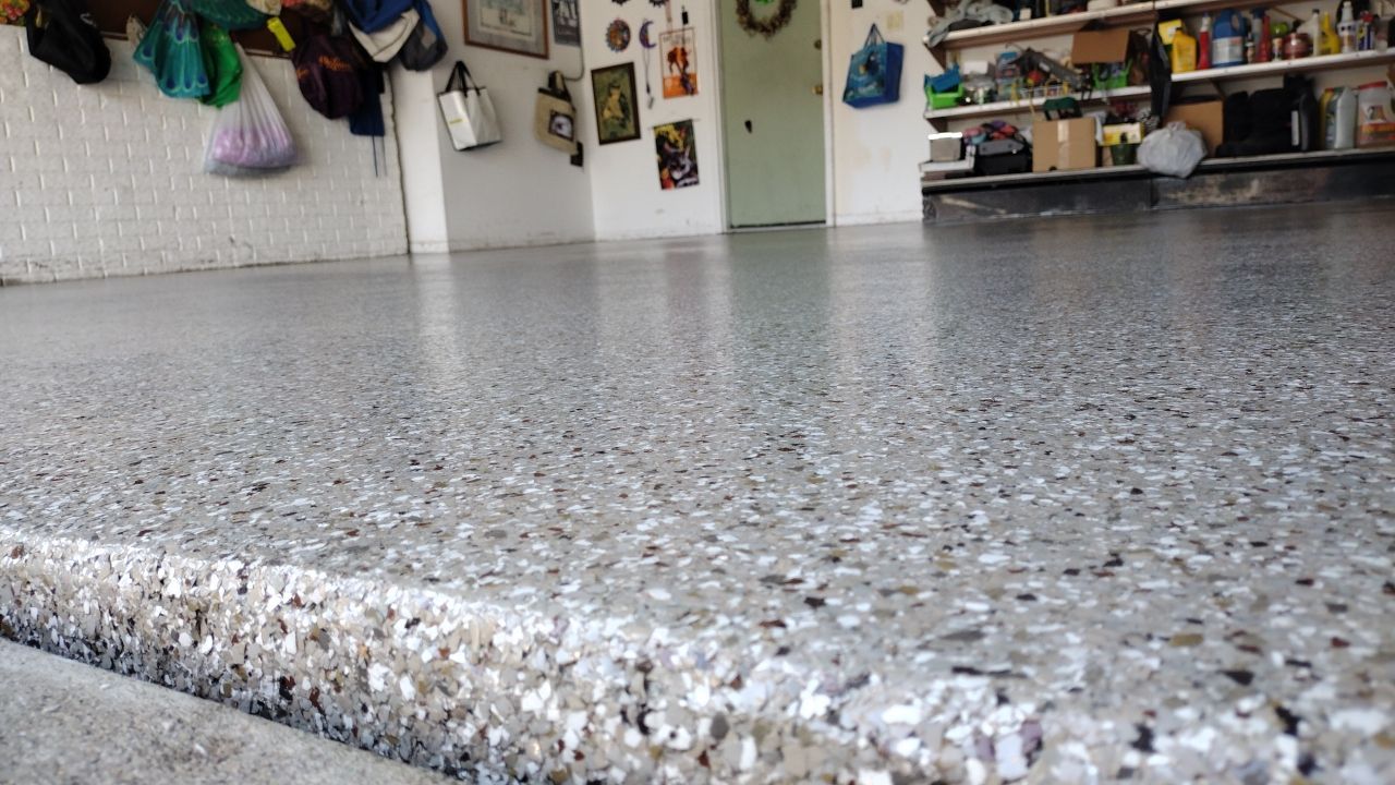 Garage Floor Coating using Pebble Bech Flakes by Revival Concrete Coatings, LLC