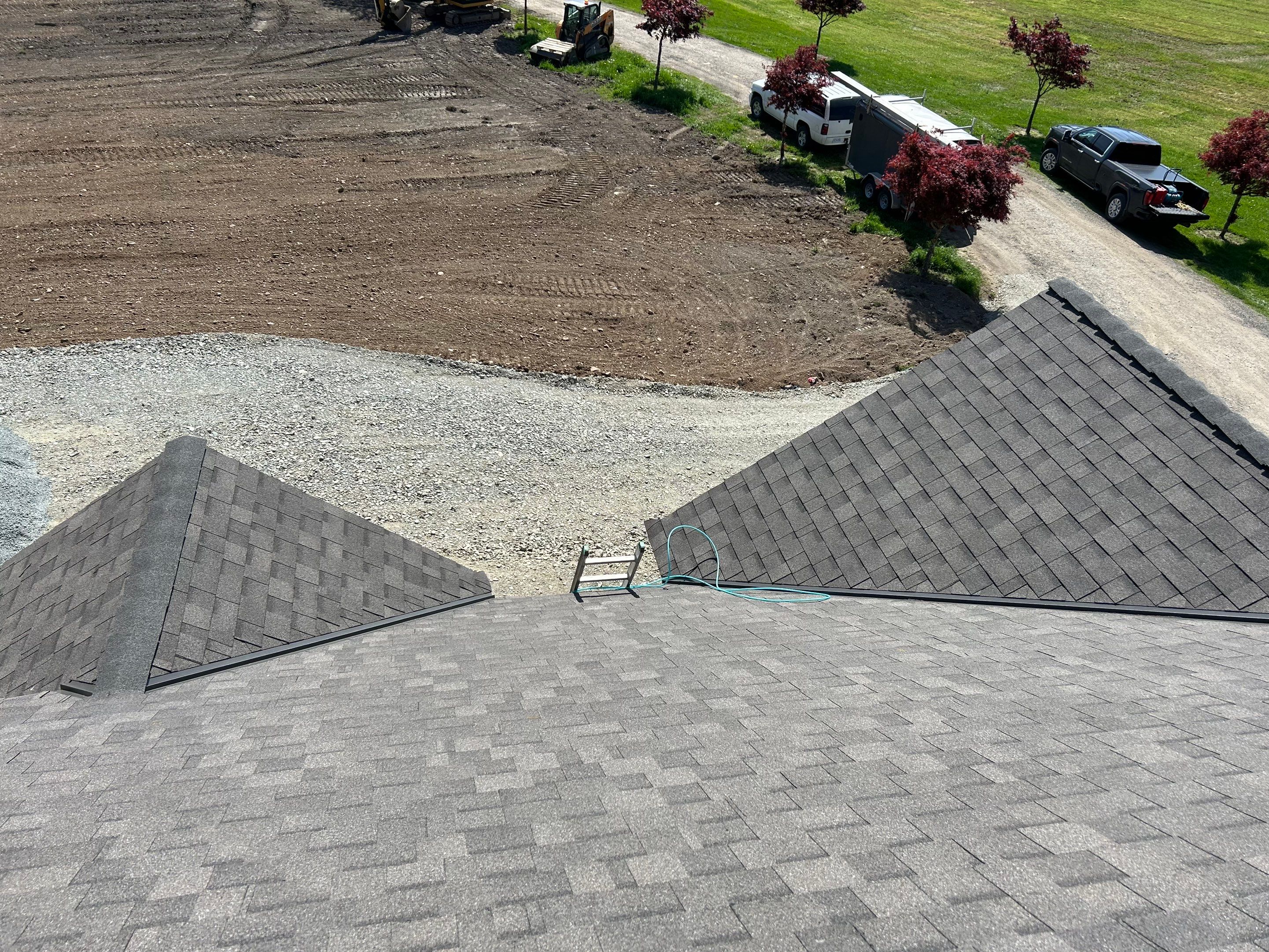 Residential Roofing Installation upgraded venting and hip and ridge capping by Top Notch Roofing Inc