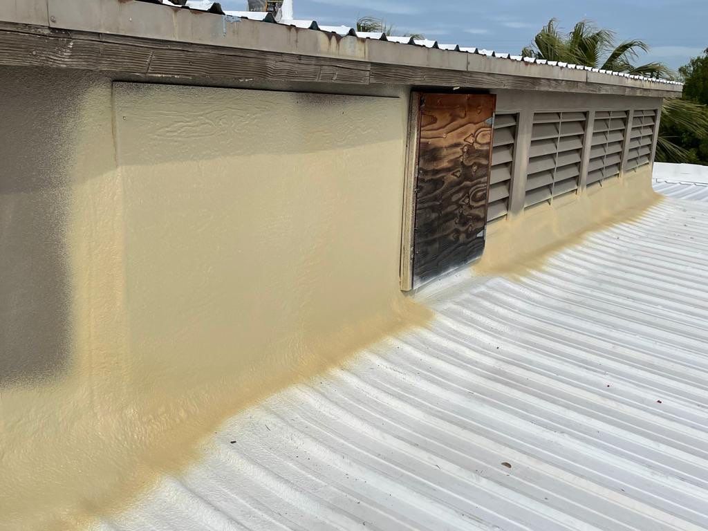 Metal roof restoration on commercial roof using Conklin Benchmark/ PUMA XL acrylic coatings over metal and foam by Straight Edge Roofing Inc
