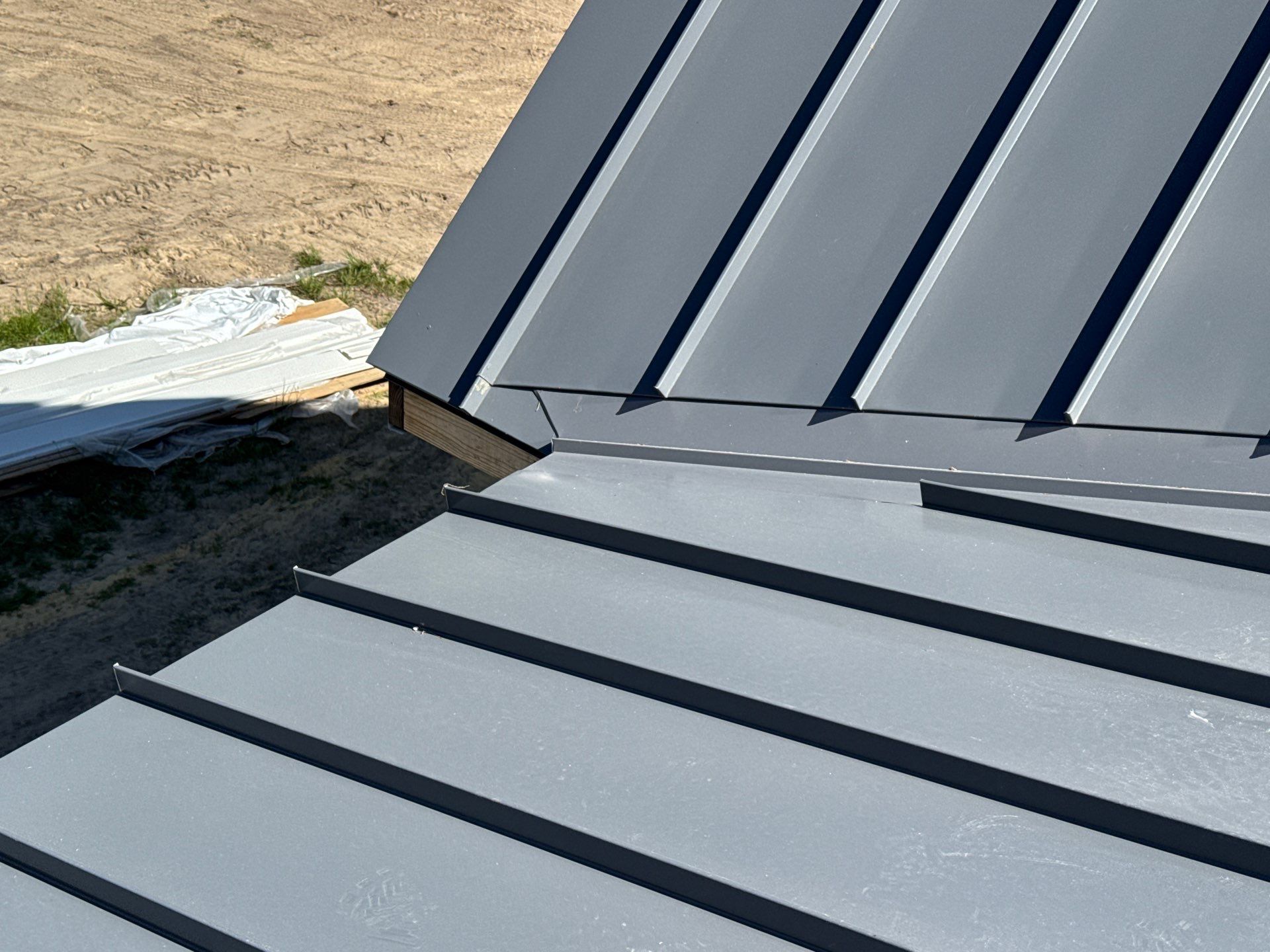 Custom New Construction Home Featuring Standing Seam Metal Roofing in Port Haywood by Cade Construction