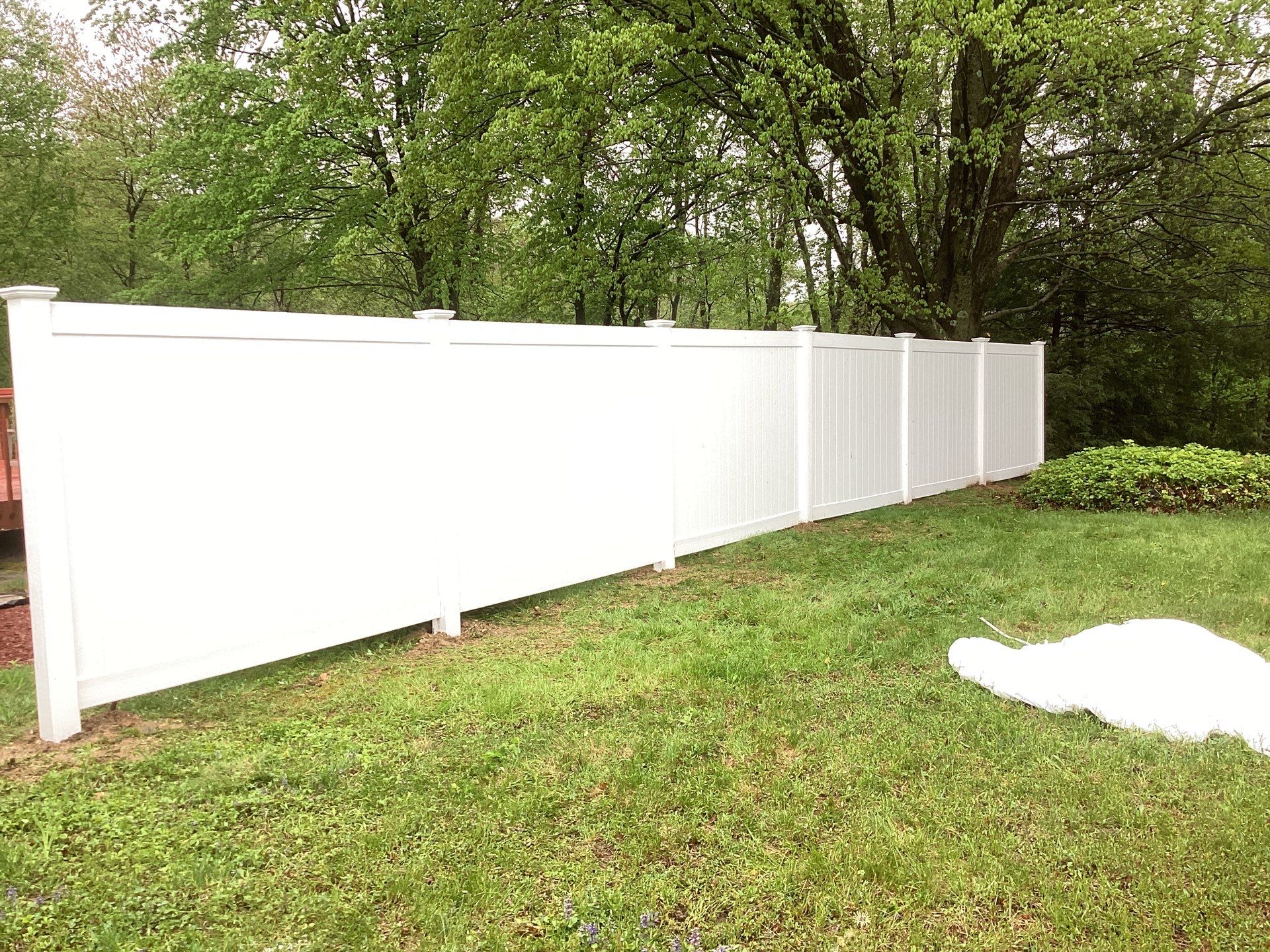 New White Vinyl privacy fence  by DiGiorgi Roofing and Siding Inc