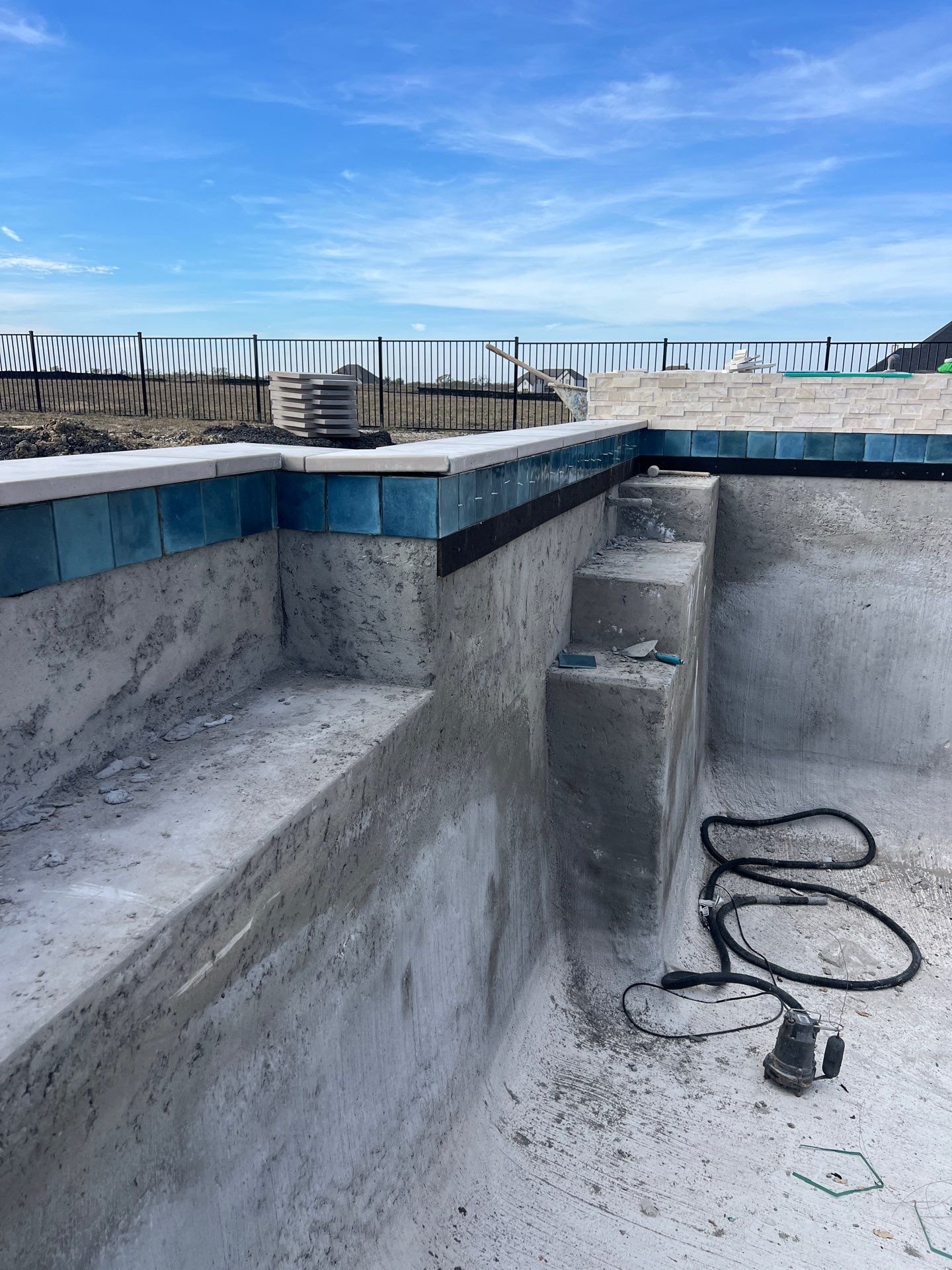 Geometric Pool with Raised Water-Feature Wall and Pergola by Pinnacle Pools and Spas - DFW