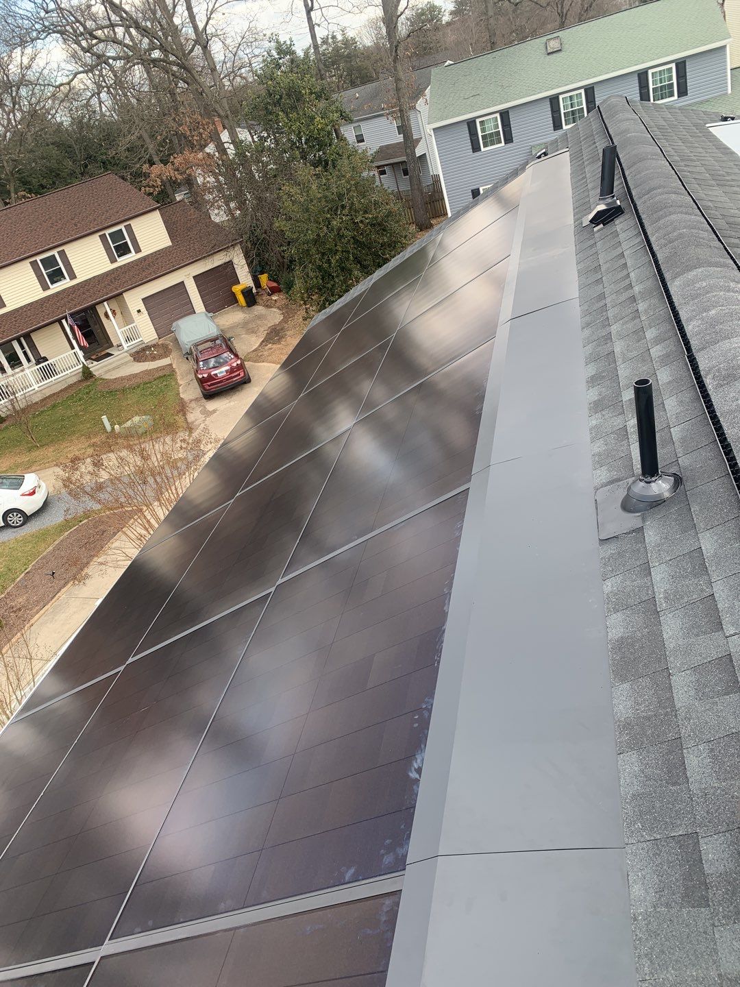 Roof Replacement with GAF Decotech integrated solar panels by American Home Contractors