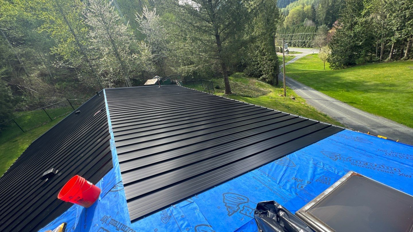 Residential ReRoofing Installation using 12" Prolok metal by Top Notch Roofing Inc