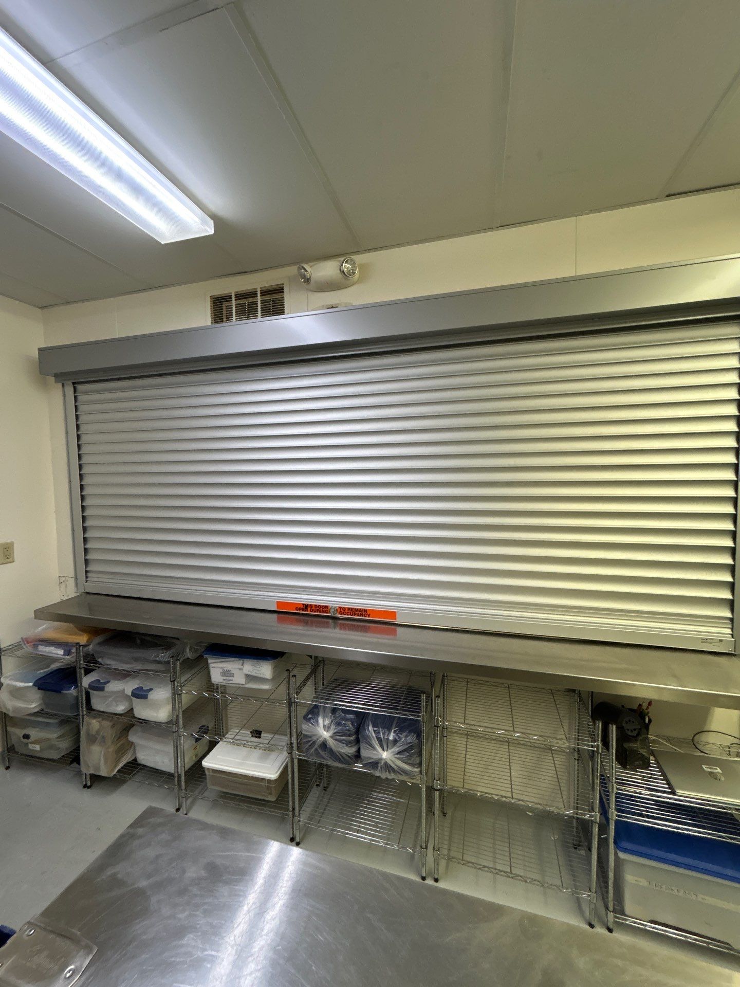 Commercial Door Installation using QMI 138''x58'' Roll up door by Keene Door