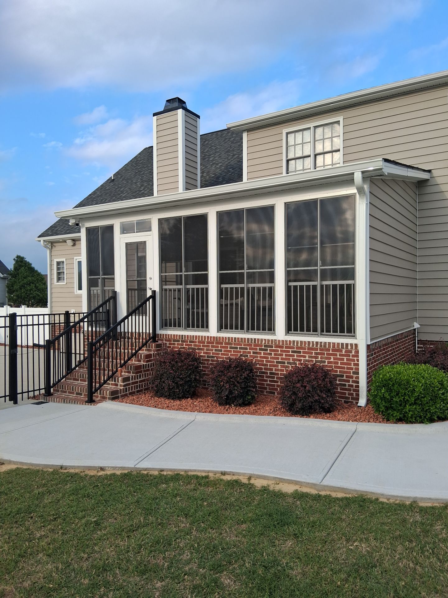 Custom Screened Porch and Concrete Walkway Installation in Rocky Mount by The Remodeling Company