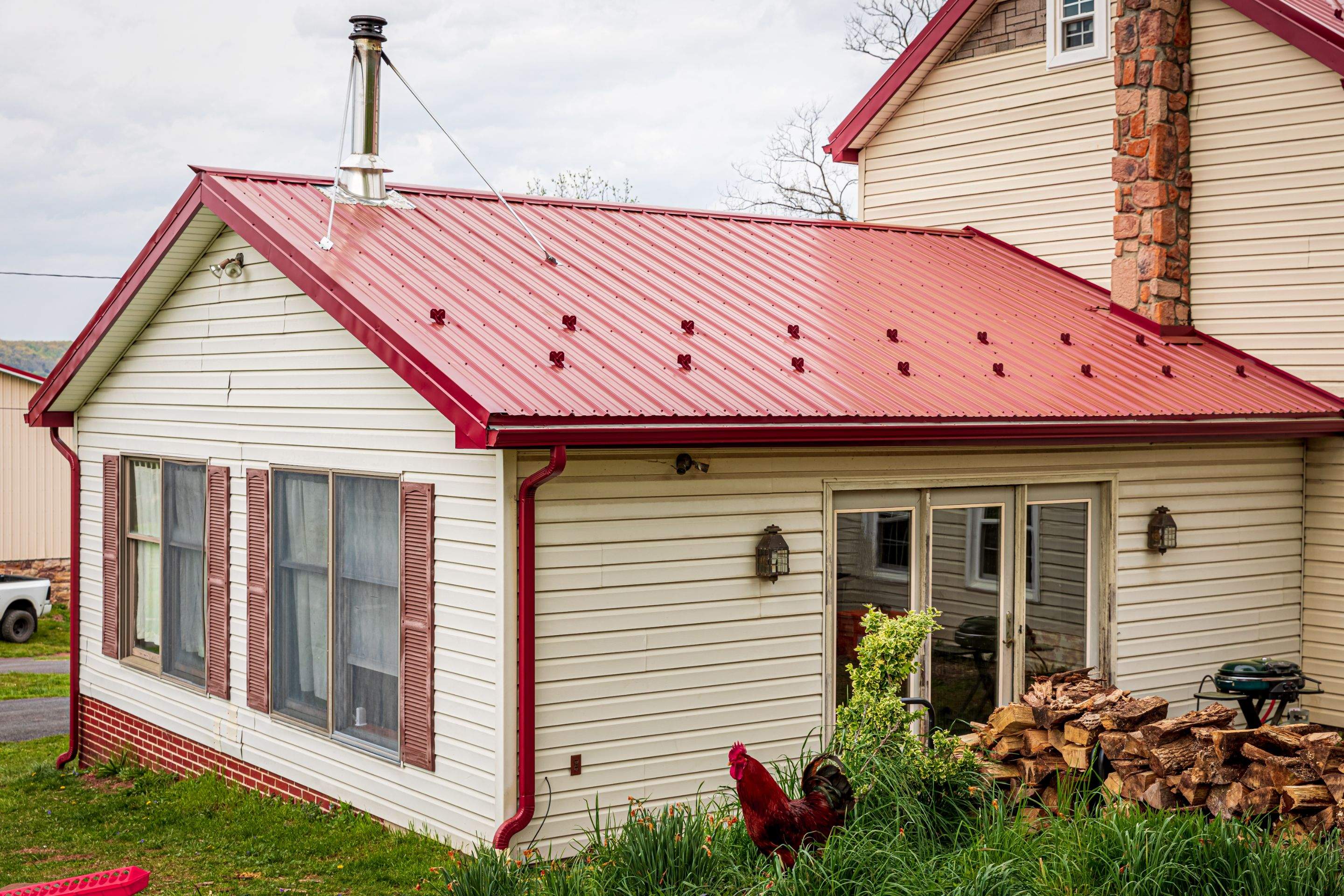 Metal Roof-coloniel red- and new siding by Esh Builders