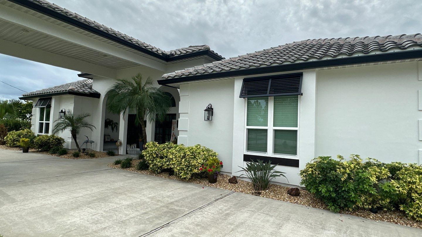 Bahama Shutters In Matte Jet Black by Smart Guard Shutters