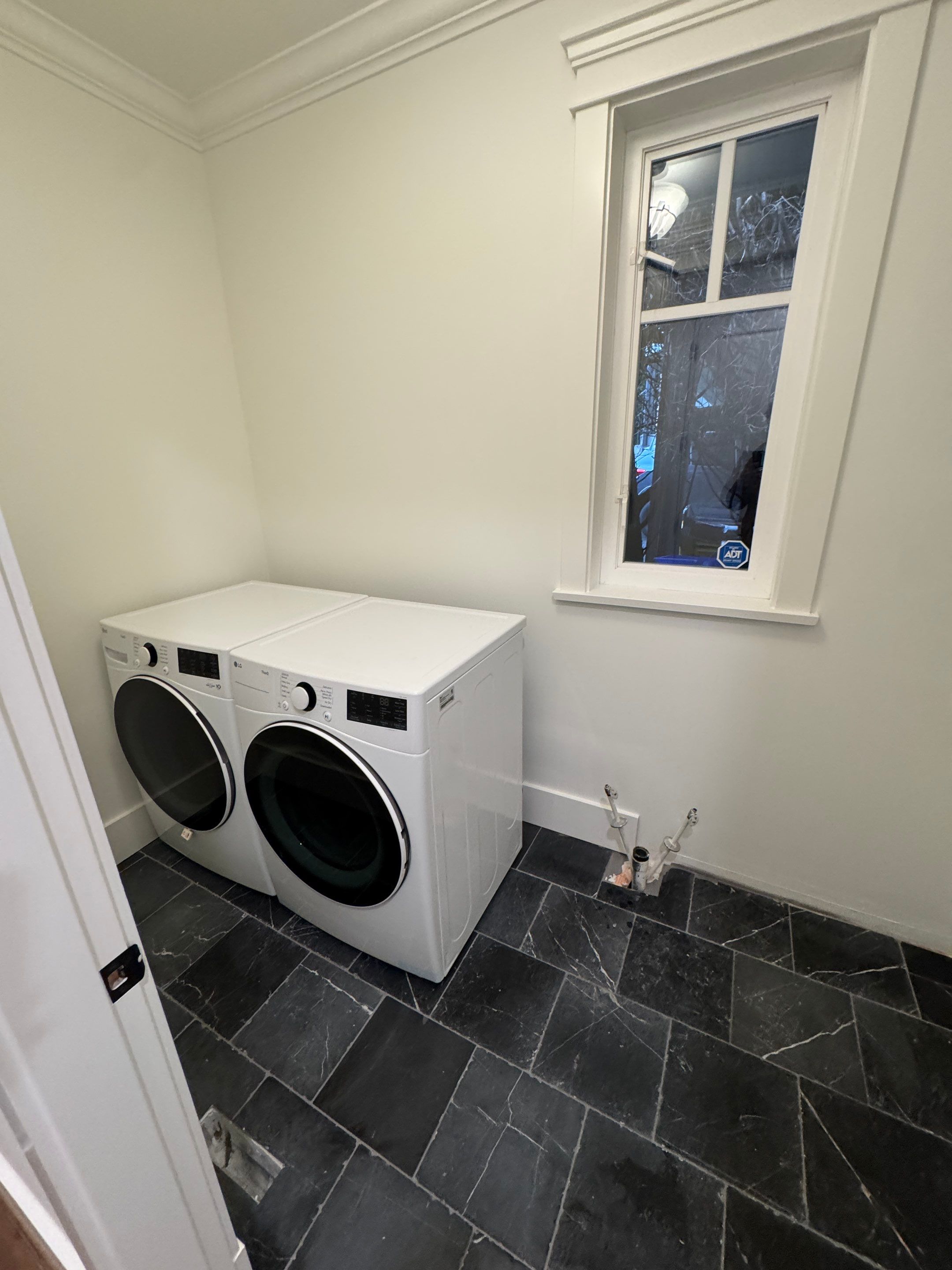 High-End Laundry Room Renovation and Restoration in Vancouver by YVR Construction Group