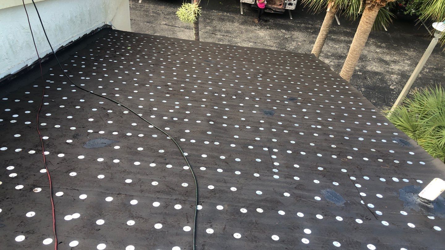Commercial Roofing Installation using 1" Nail strip metal roof by BLUES BROTHERS ROOFING