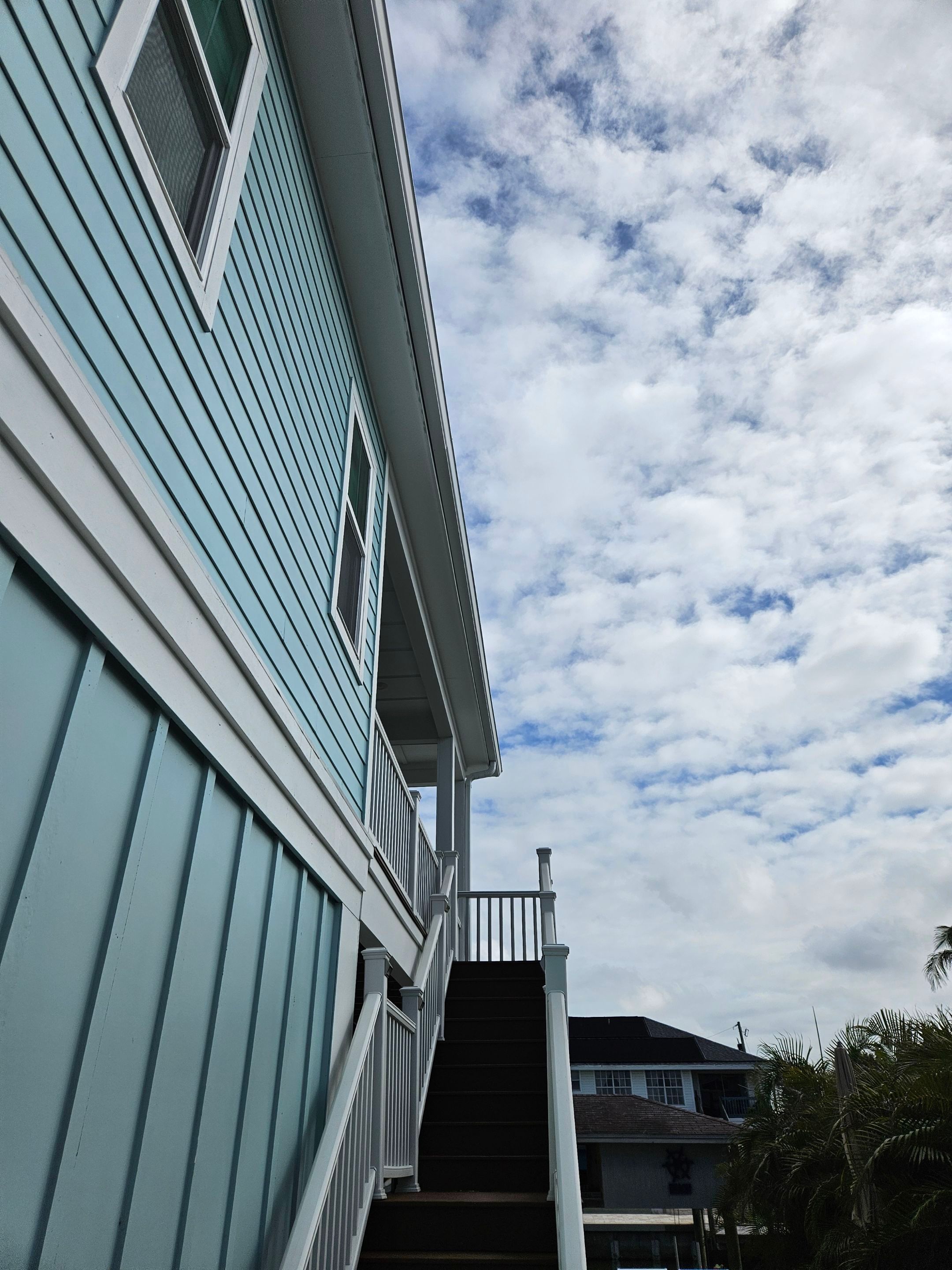 New White Seamless Gutters Installation and Downspouts, Reseal Gutters in Fort Myers Beach, FL  by Gutter Professors