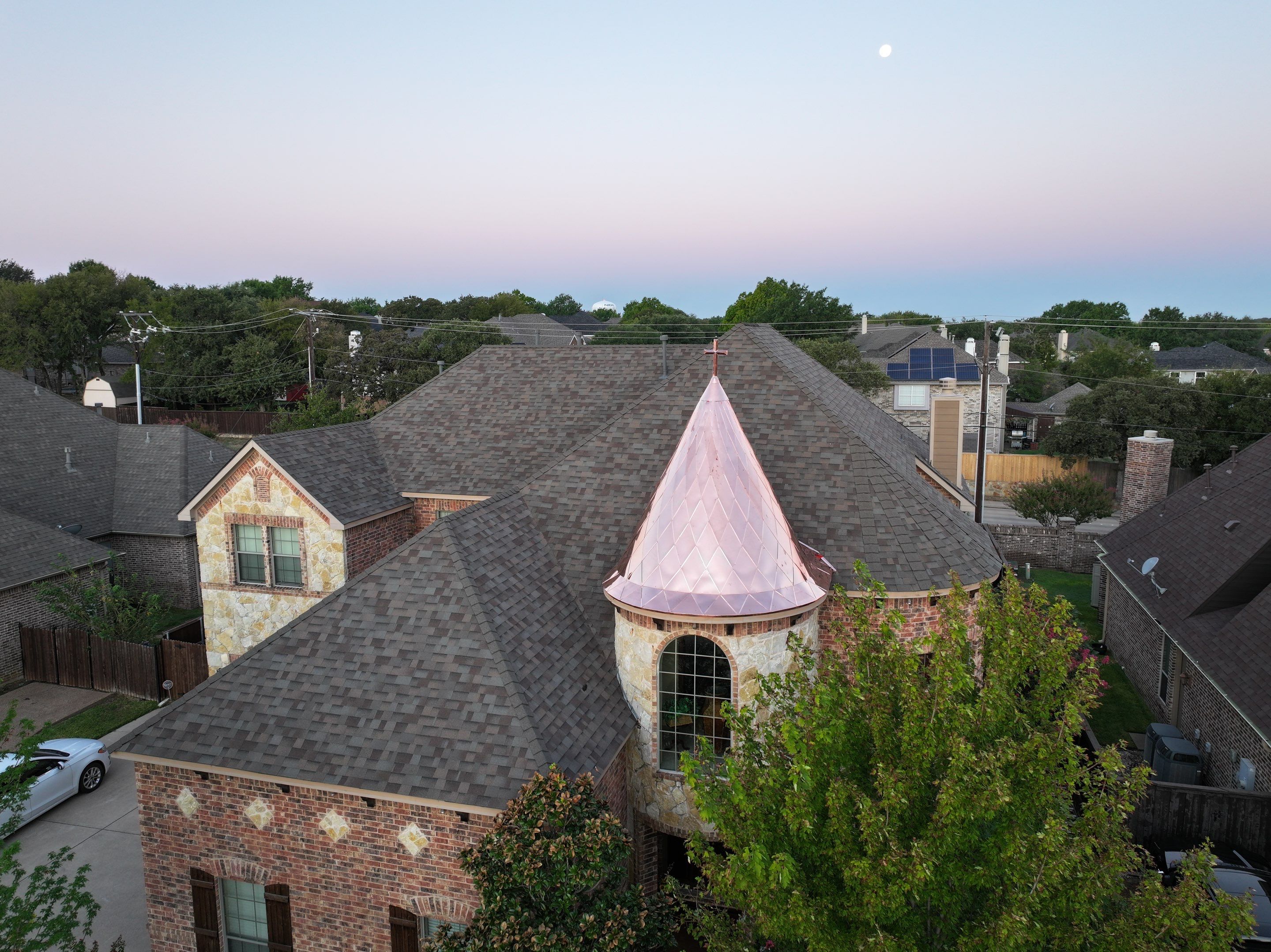 Installing Custom copper turret and Malarkey Vista Class 4 shingles Hail Damage Upgrade by Becker Roofing and Exteriors