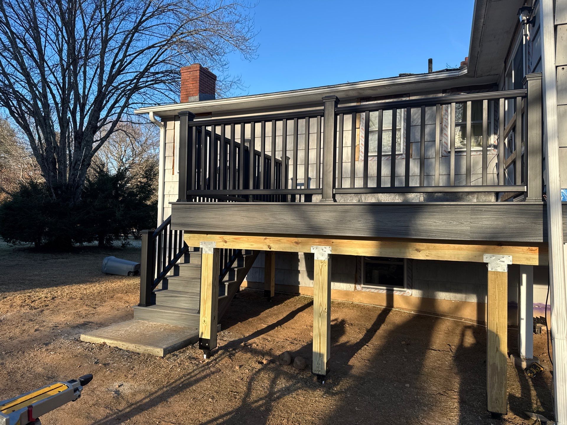 New Deck, Trex Tropical Island mist boards and Fascia. Black composite trex railing. by DiGiorgi Roofing and Siding Inc