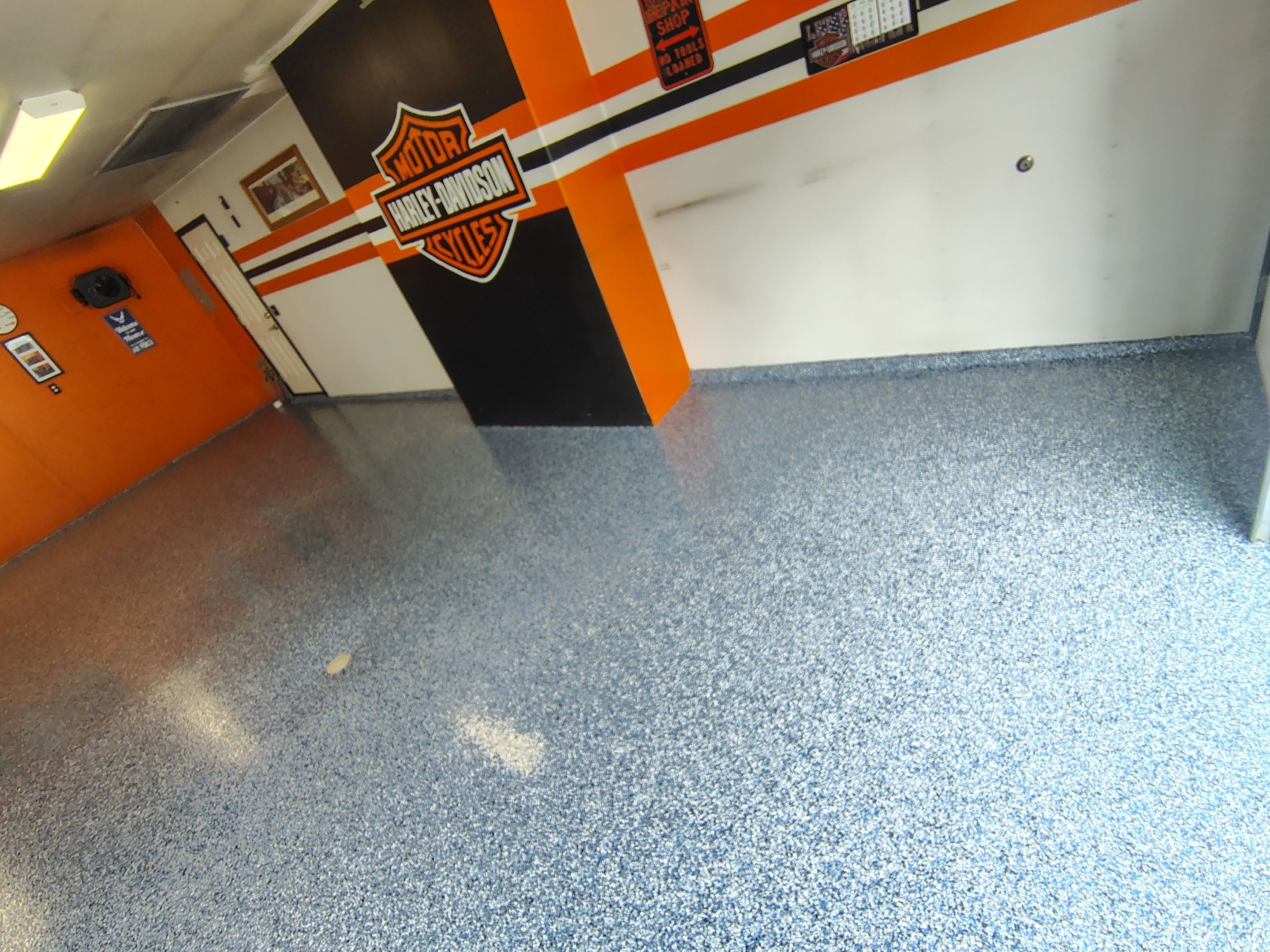 Custom Grey Flake Epoxy Garage Floor Installation in Remsen by Select Painting, Coatings & Garage Cabinets