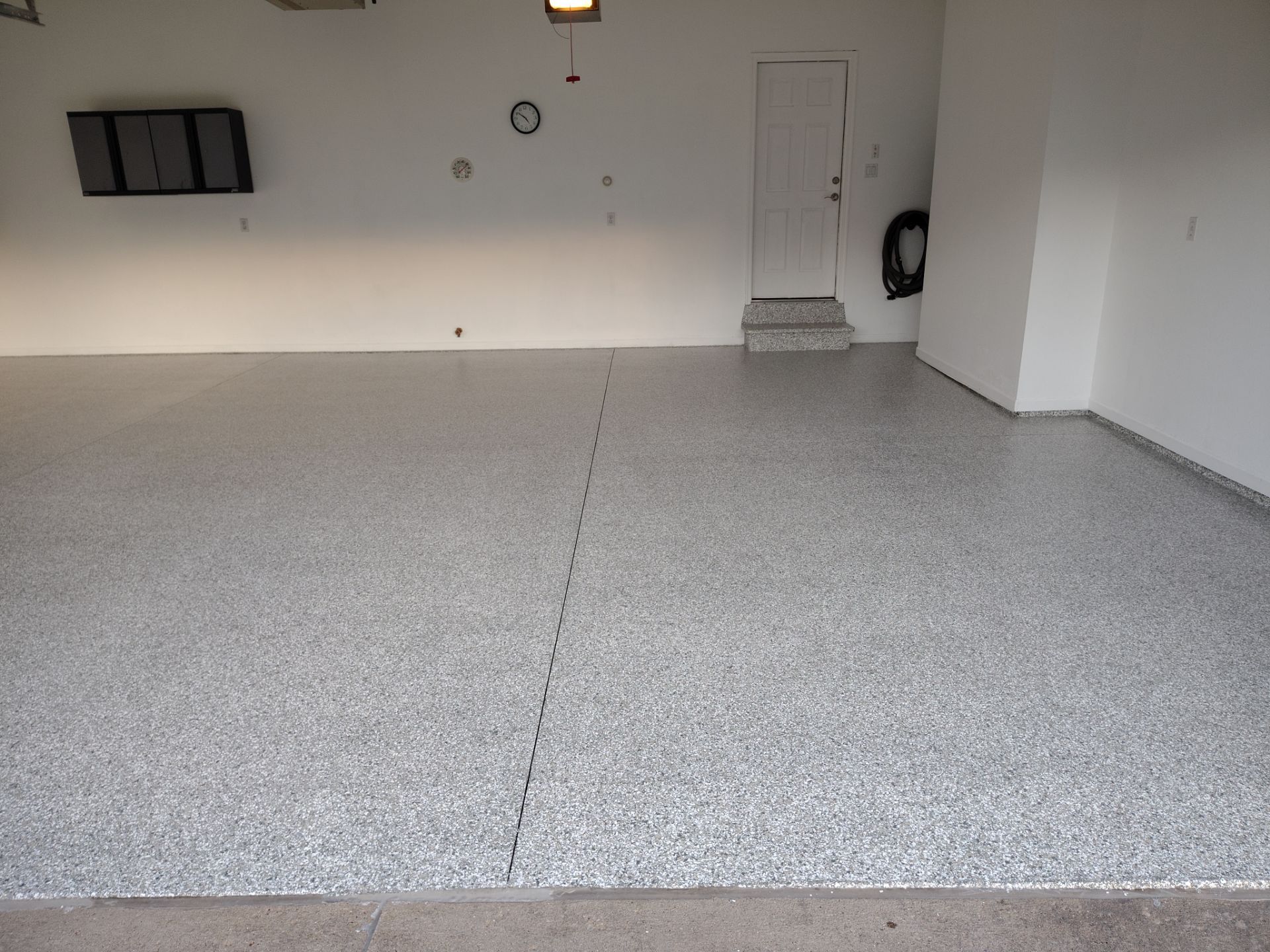 New Johnston Garage Resurfacing by Revival Concrete Coatings, LLC