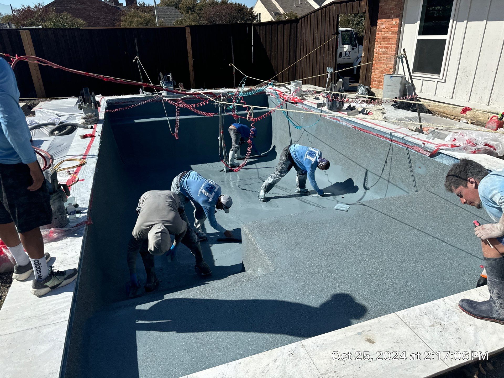 Classic Geometric Pool with Expansive Concrete Deck by Pinnacle Pools and Spas - DFW