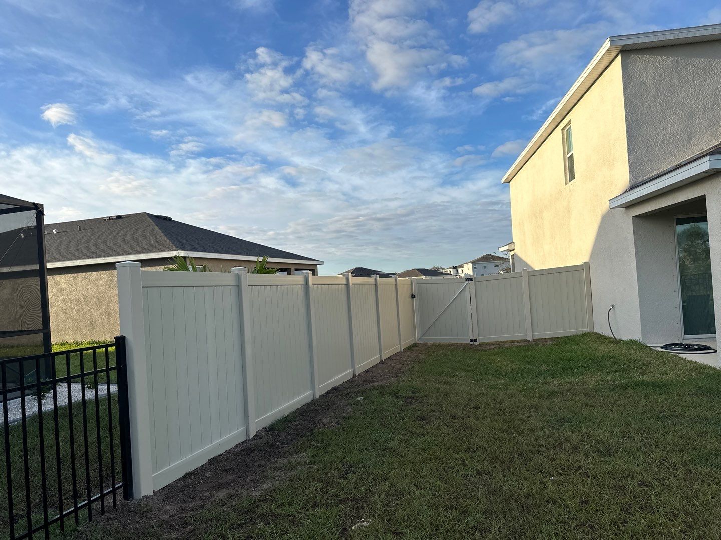 Vinyl Fence Installation using Vinyl Fence and a Black 3 Rail Aluminum Fence by Asap fence and gates, LLC