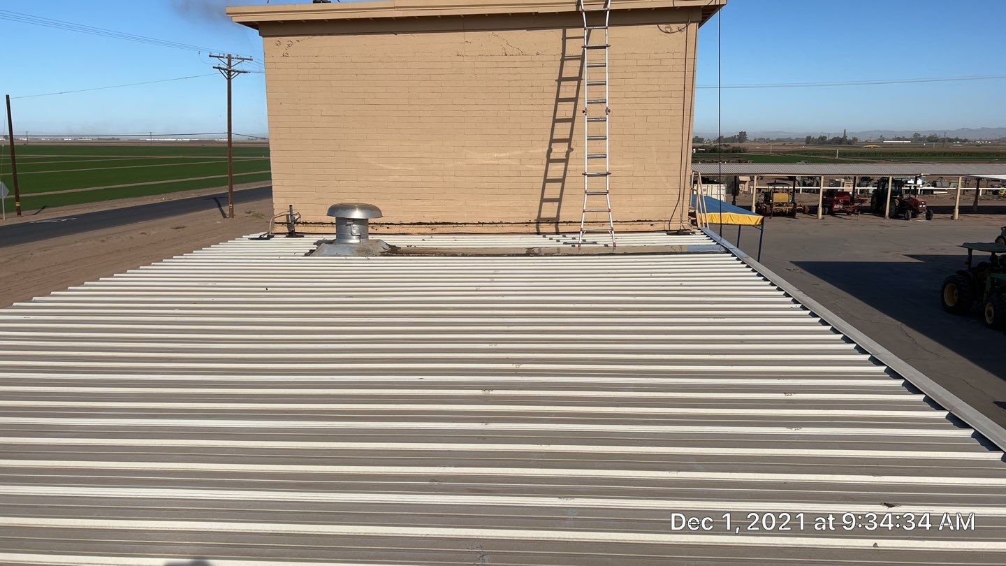 Metal roof restoration on commercial roof using Conklin Benchmark/PUMA XL fabric and coating by Straight Edge Roofing Inc