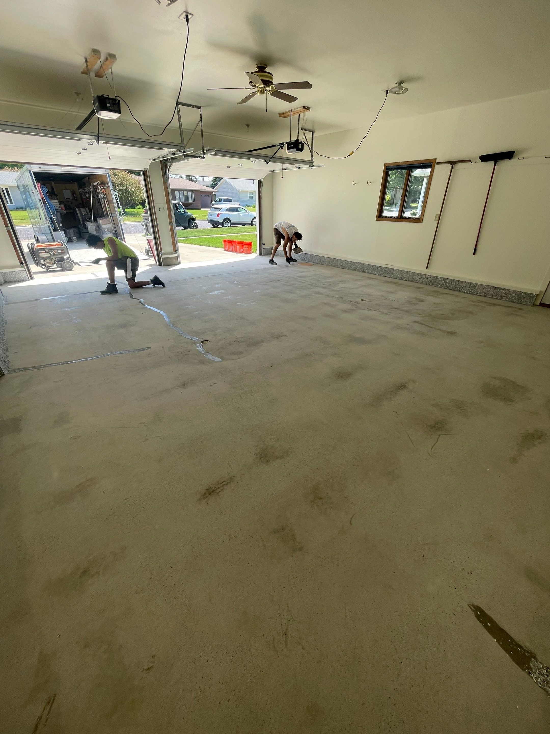 Madison Garage Concrete Coating with Feather Grey Speckle Finish by Select Painting, Coatings & Garage Cabinets