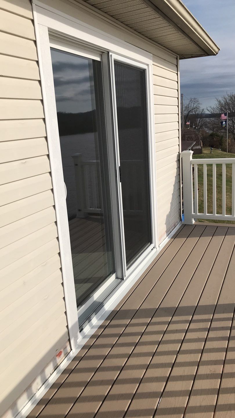 Deck Refurbush and Door Replacement using Trex Decking and Railing. Polaris Patio Doors by Secure Construction Company Inc