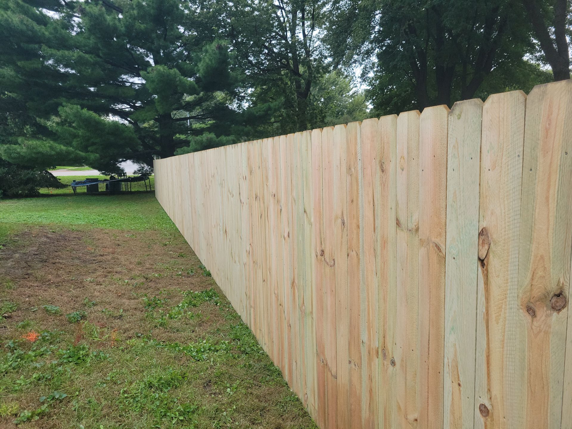 Pressure-Treated Wood Privacy Fence Installation in Waverly by Perfect Picket Fence and Stain