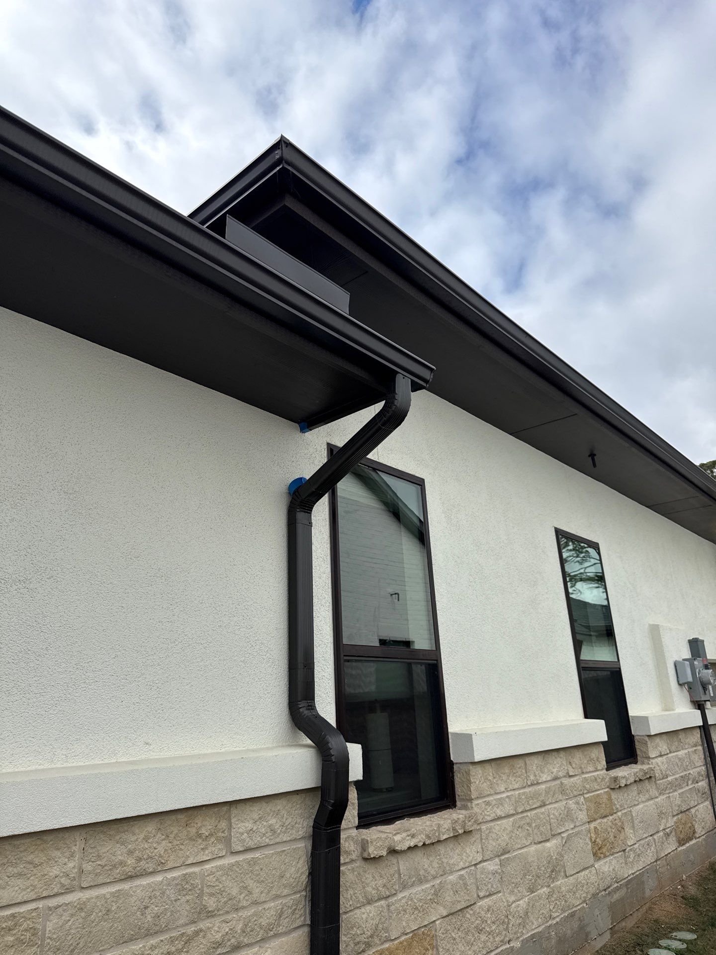 Magnolia Contrast: Light Stucco with Dark Accents and Stone Details by Apex Conventional Stucco Llc