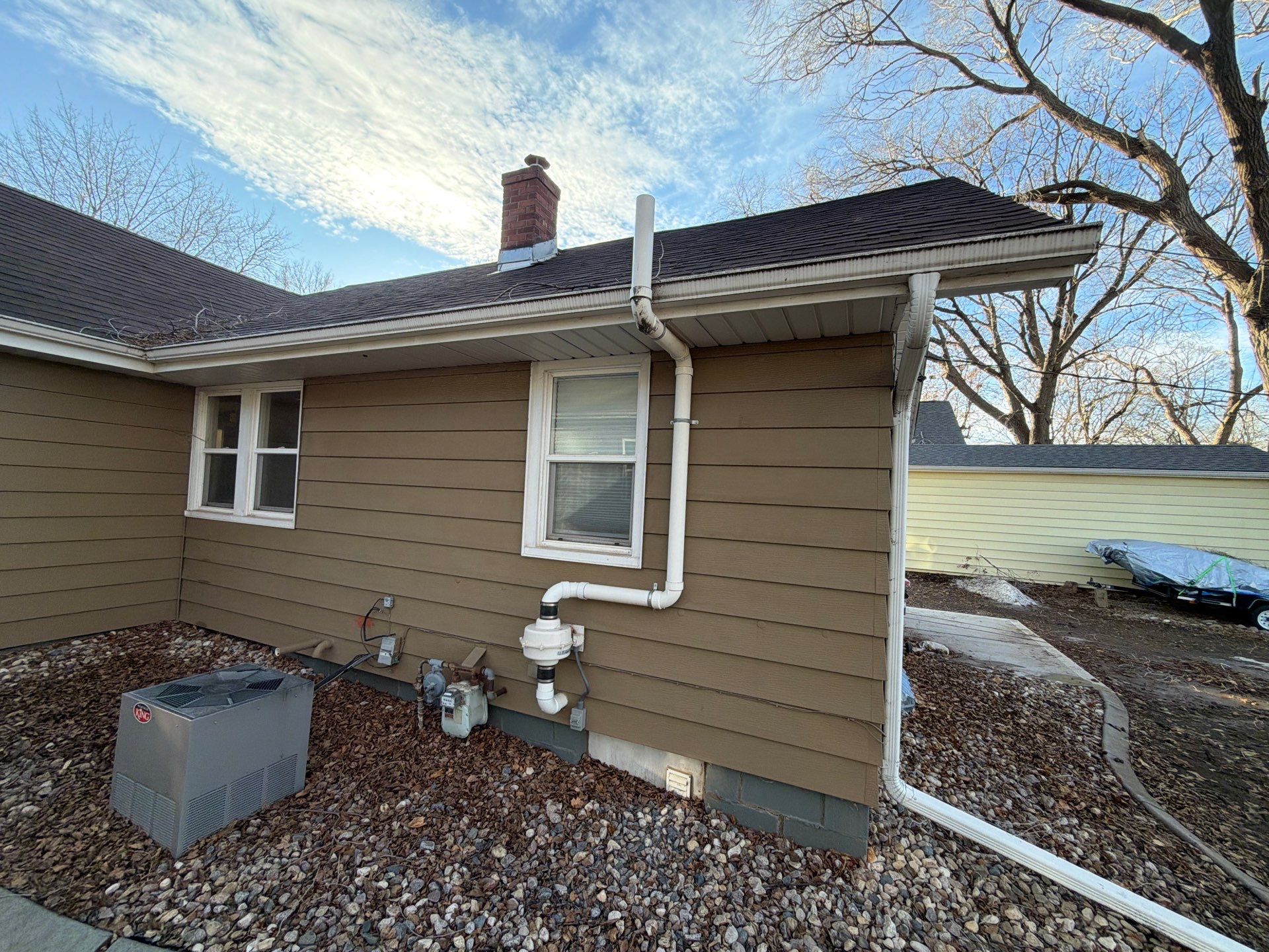 Exterior Siding Repair and Full House Repaint in Sioux Falls by Select Painting, Coatings & Garage Cabinets